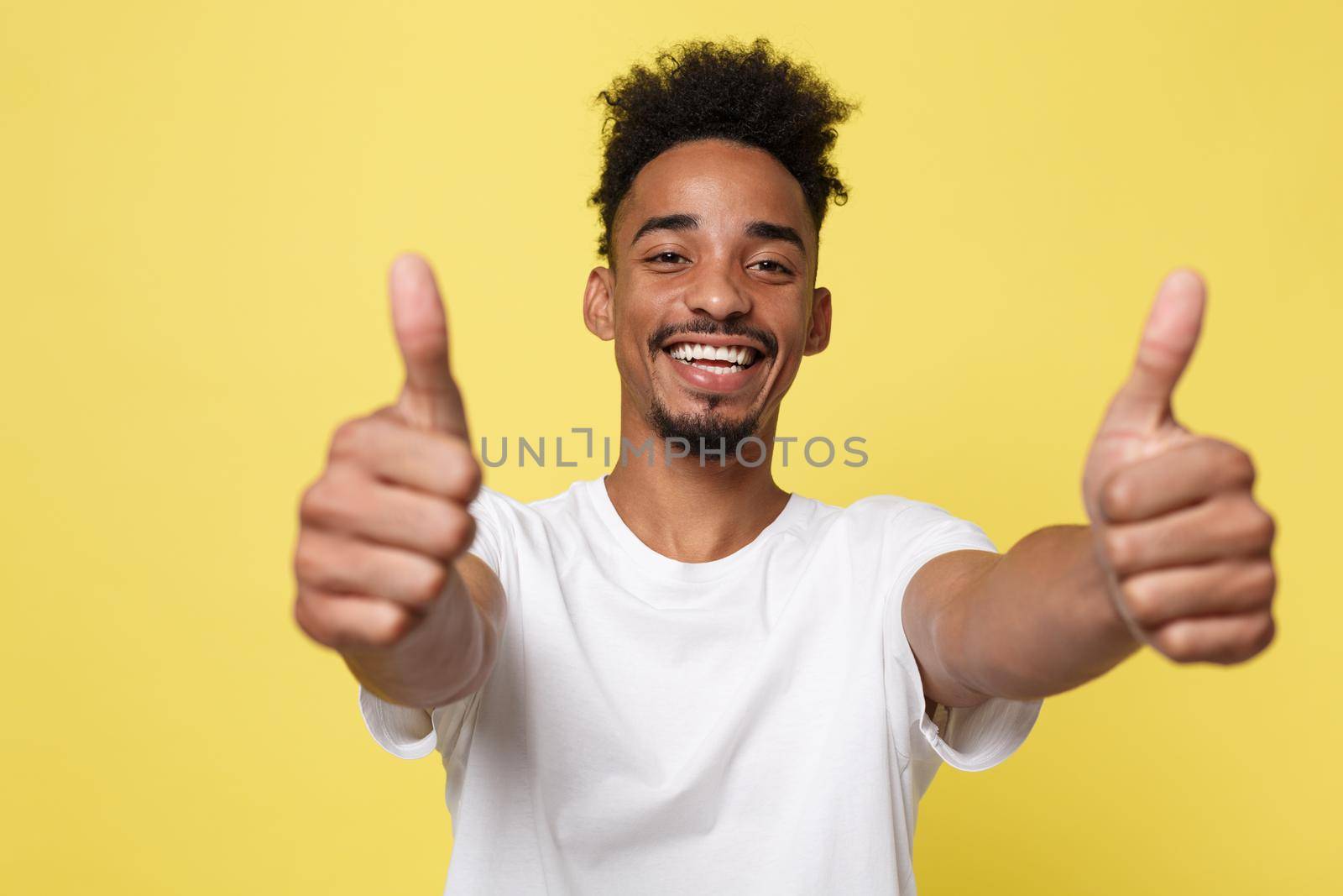 Happy African-American Businessman isolated on yellow background
