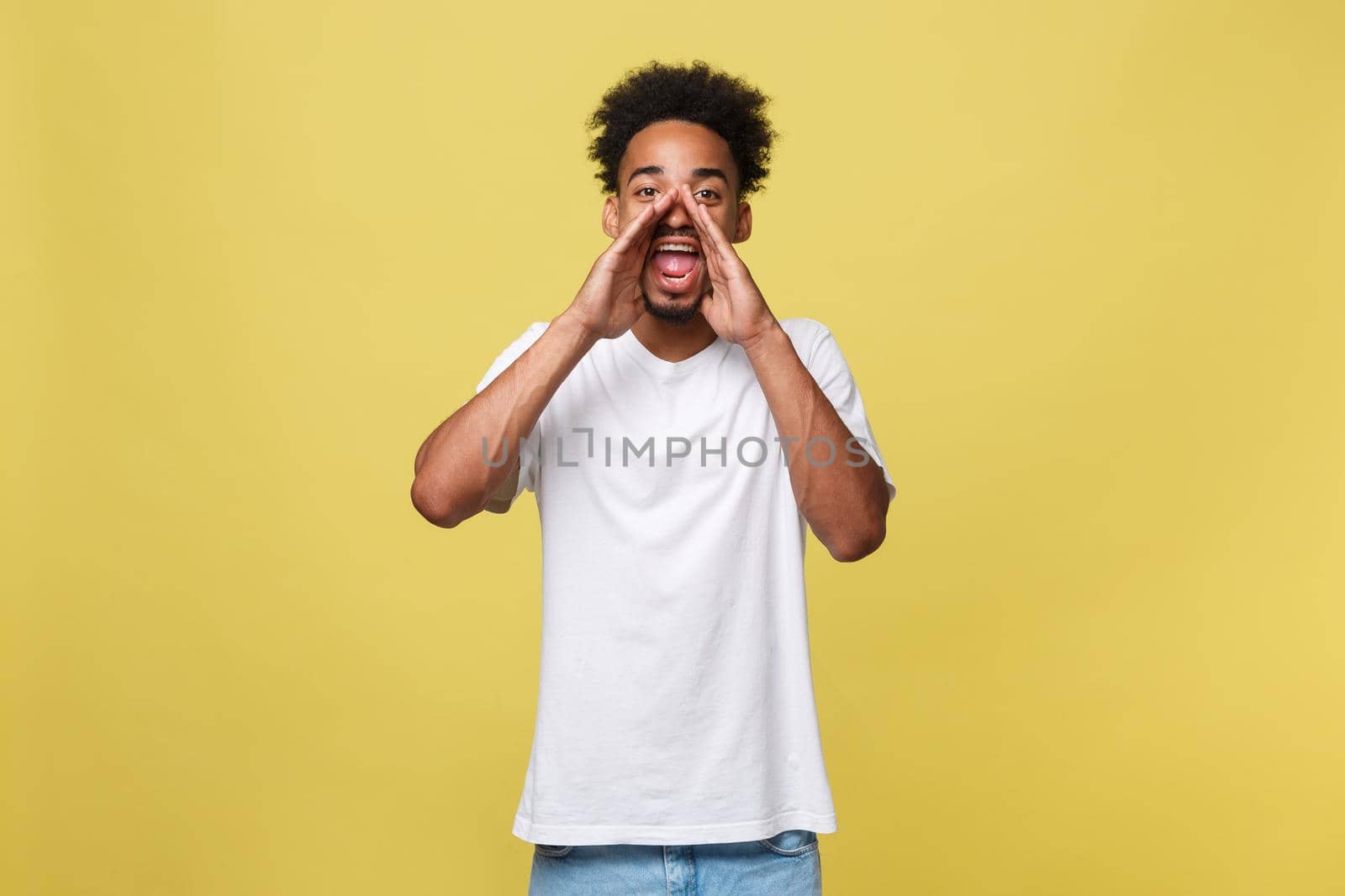 positive young black guy, student, worker employee screams mouth wide open and putting his hands to his face as mouthpiece. Portrait on white background in casual clothing. by Benzoix
