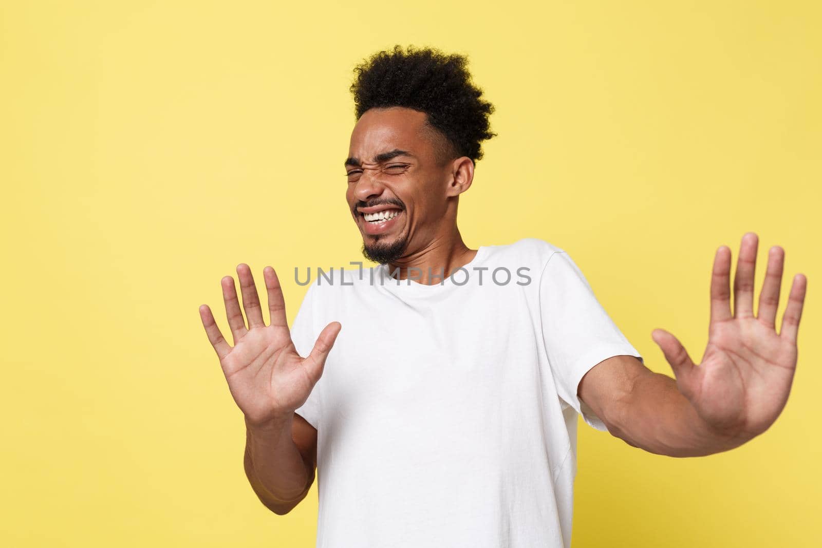 Portrait furious angry annoyed displeased young man raising hands up to say no stop right there isolated orange background. Negative human emotion, facial expression, sign, symbol, body language