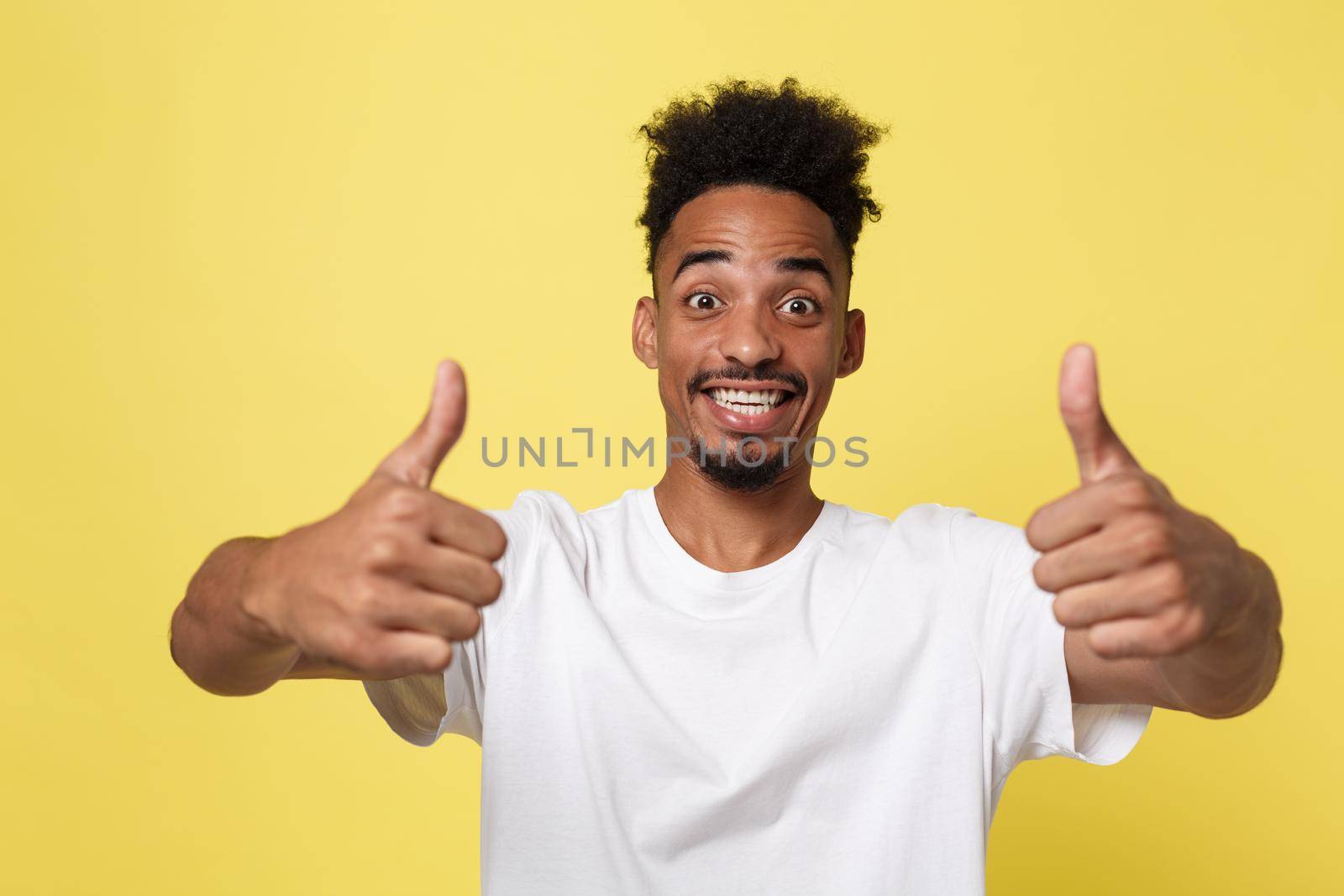 Happy African-American Businessman isolated on yellow background