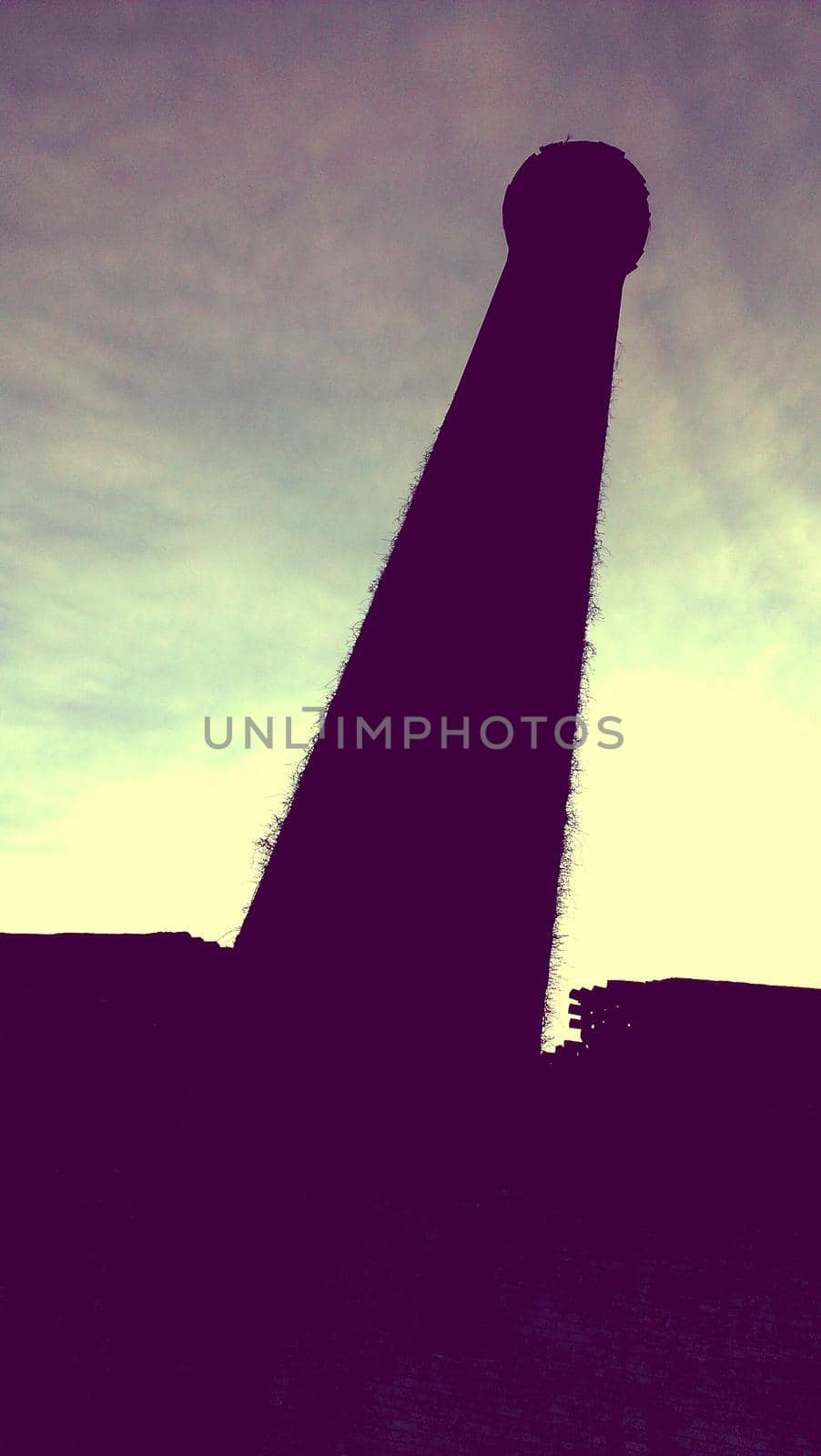 Image of Tall tower silhouetted against a light sky