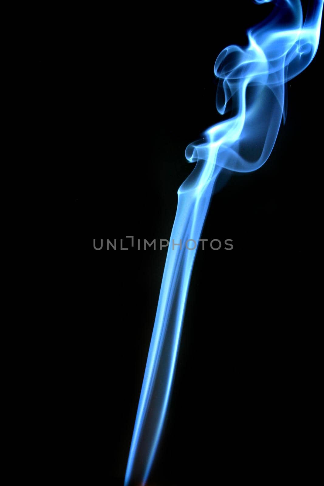 Image of Blue smoke trailing upwards in abstract form on a black background