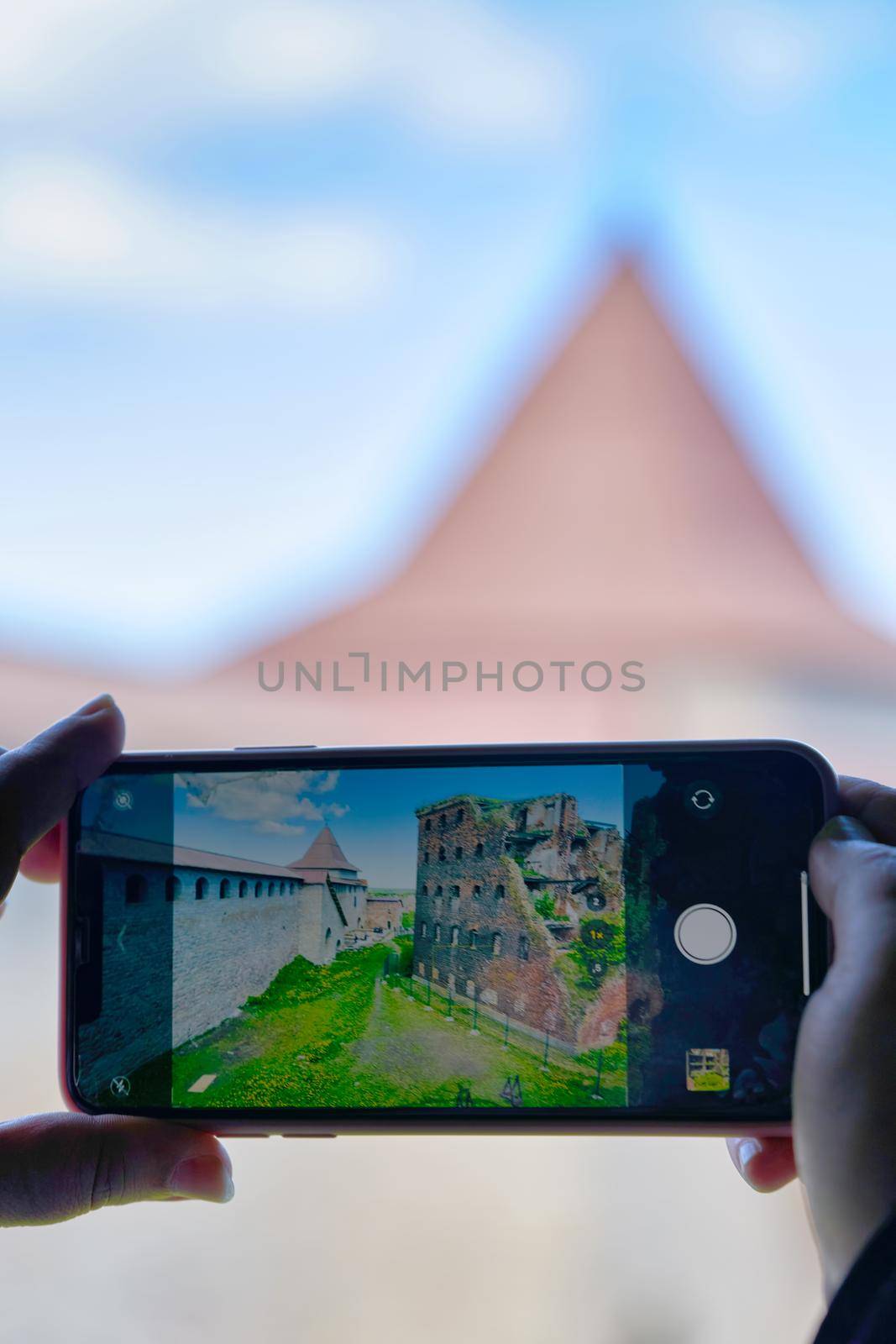 Taking a photo on a smartphone while traveling. Fortress Oreshek by vizland