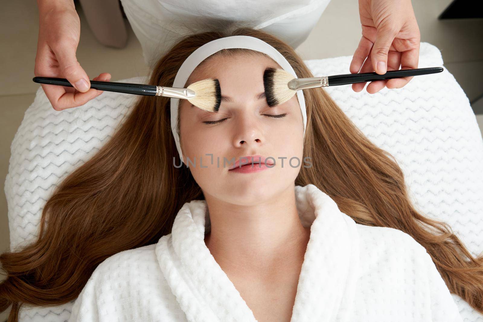 Face Skin Care. Woman Gets Brushes Treatment At Beauty Clinic