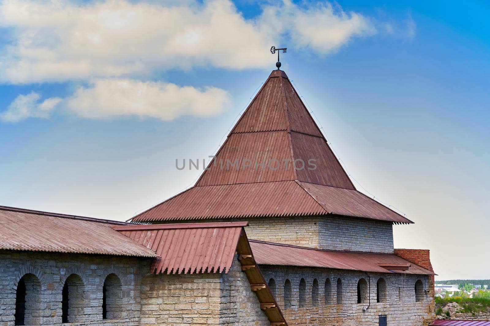 View of the old stone fortress with a watchtower. Fortress Oreshek on a sunny summer day