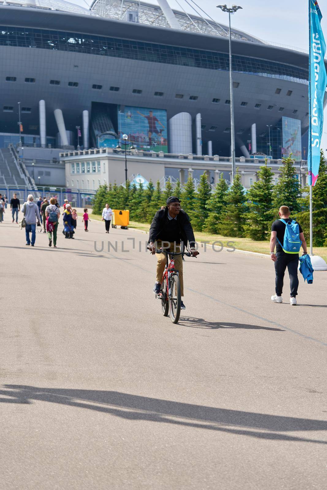 Saint Petersburg, Russia - June 12, 2021: People walk near Zenit Stadium during the Euro 2020 championship in St. Petersburg