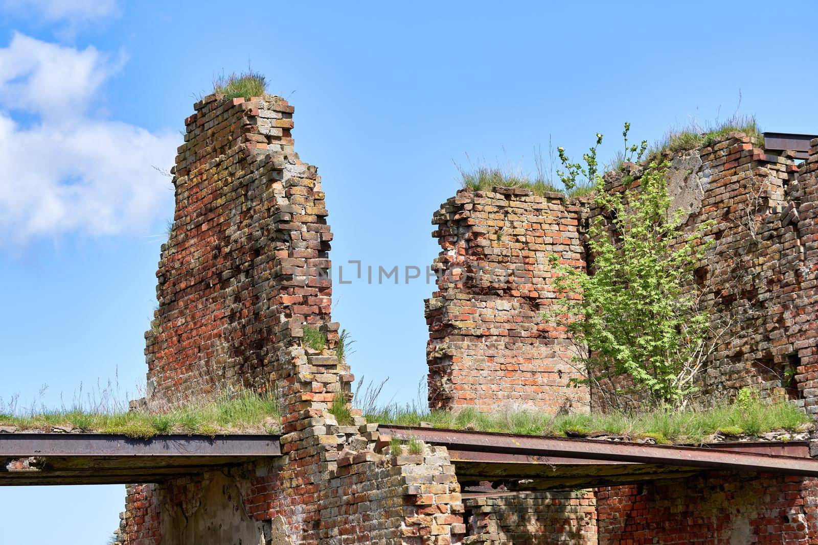 A destroyed brick building on the territory of the Oreshek fortress, red brick ruins