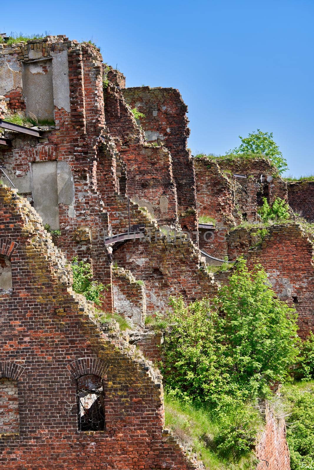 A destroyed brick building on the territory of the Oreshek fortress, red brick ruins