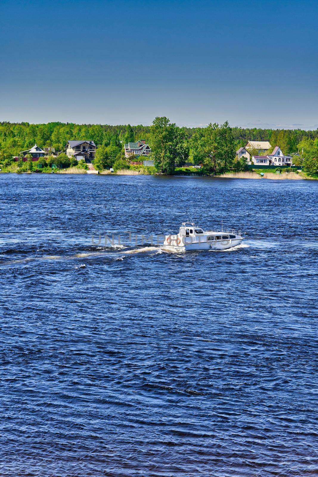 The river boat transports people to the other side. River crossing by water