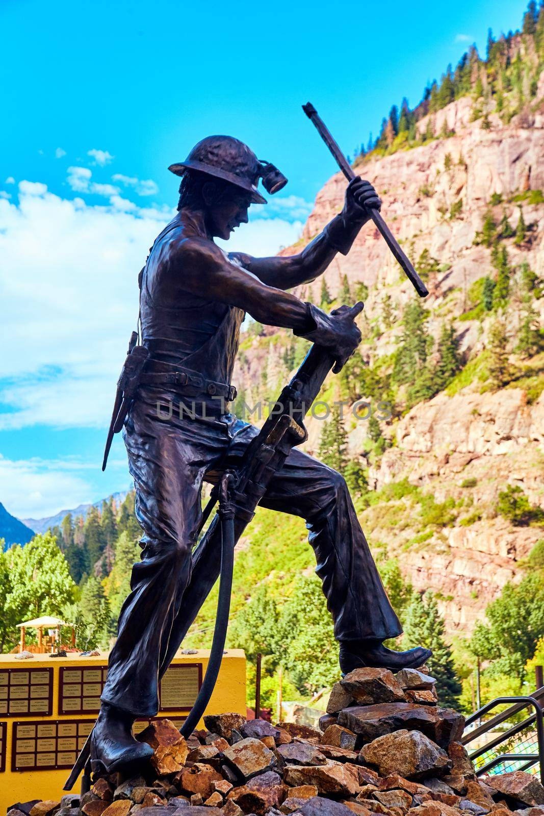 Statue of miner with background of mountains by njproductions