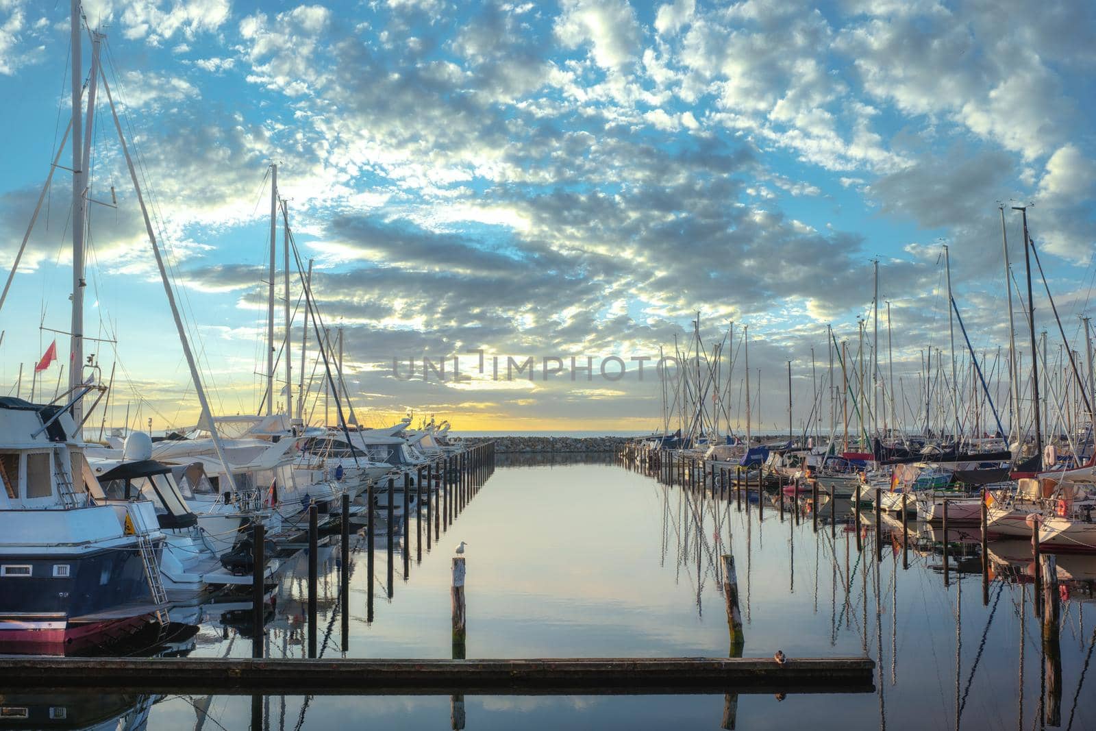 Boat jetty with yachts on a pier in the morning