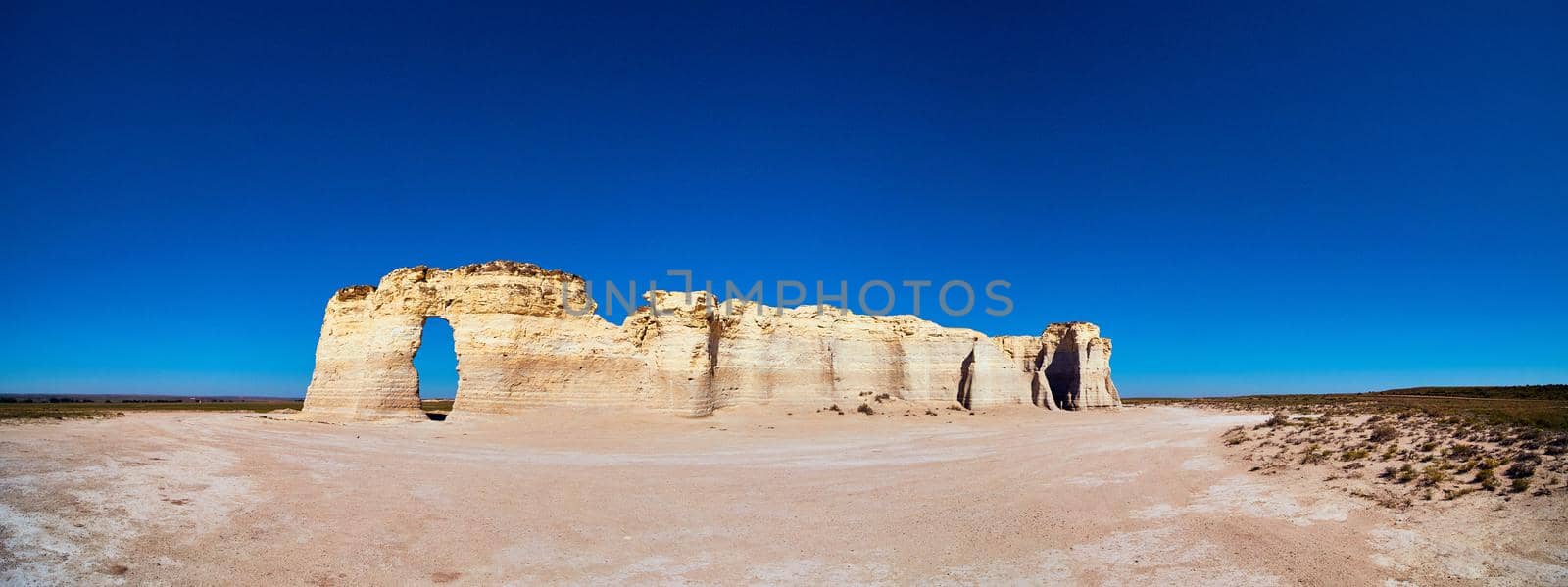 Panorama of large wavy white rocks in middle of flat desert by njproductions