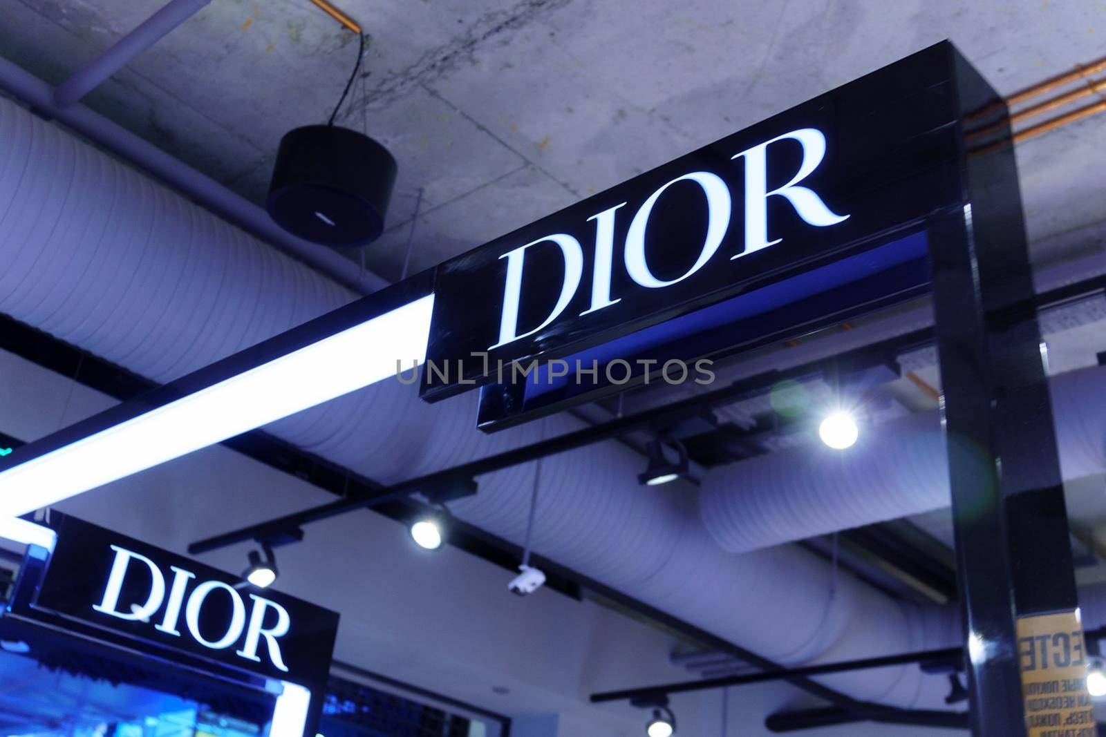 Volgograd, Russia-September 16, 2021: The Dior brand logo on the wall in the mall. Selective focus