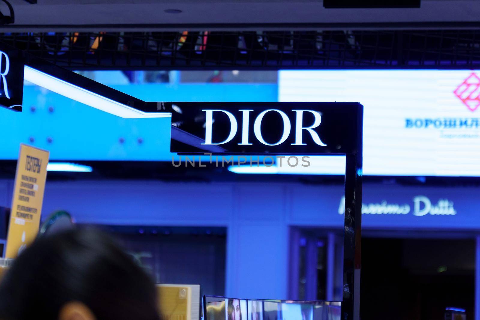 Volgograd, Russia-September 16, 2021: Dior store logo in shopping centre. Dior is a French company founded by designer Christian Dior.