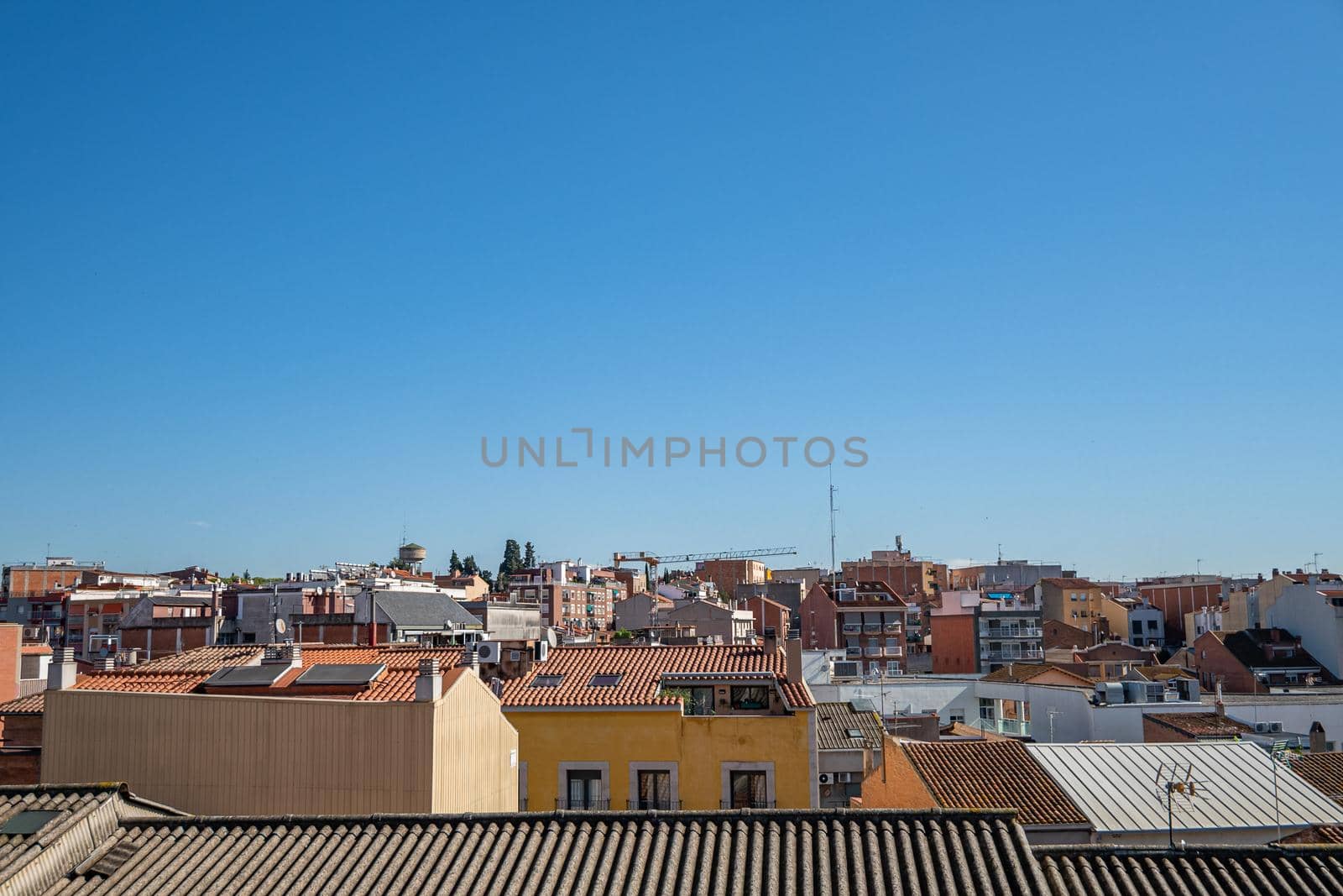 Panoramic view over the roofs of Ripollet, Catalonia, Spain. by apavlin