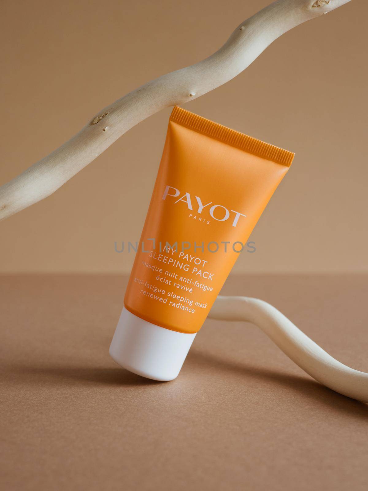 Moscow, Russia, 08.30.2021 Skin moisturizer cosmetic care night mask Payot with orange package on shiny beige background. by katrinaera