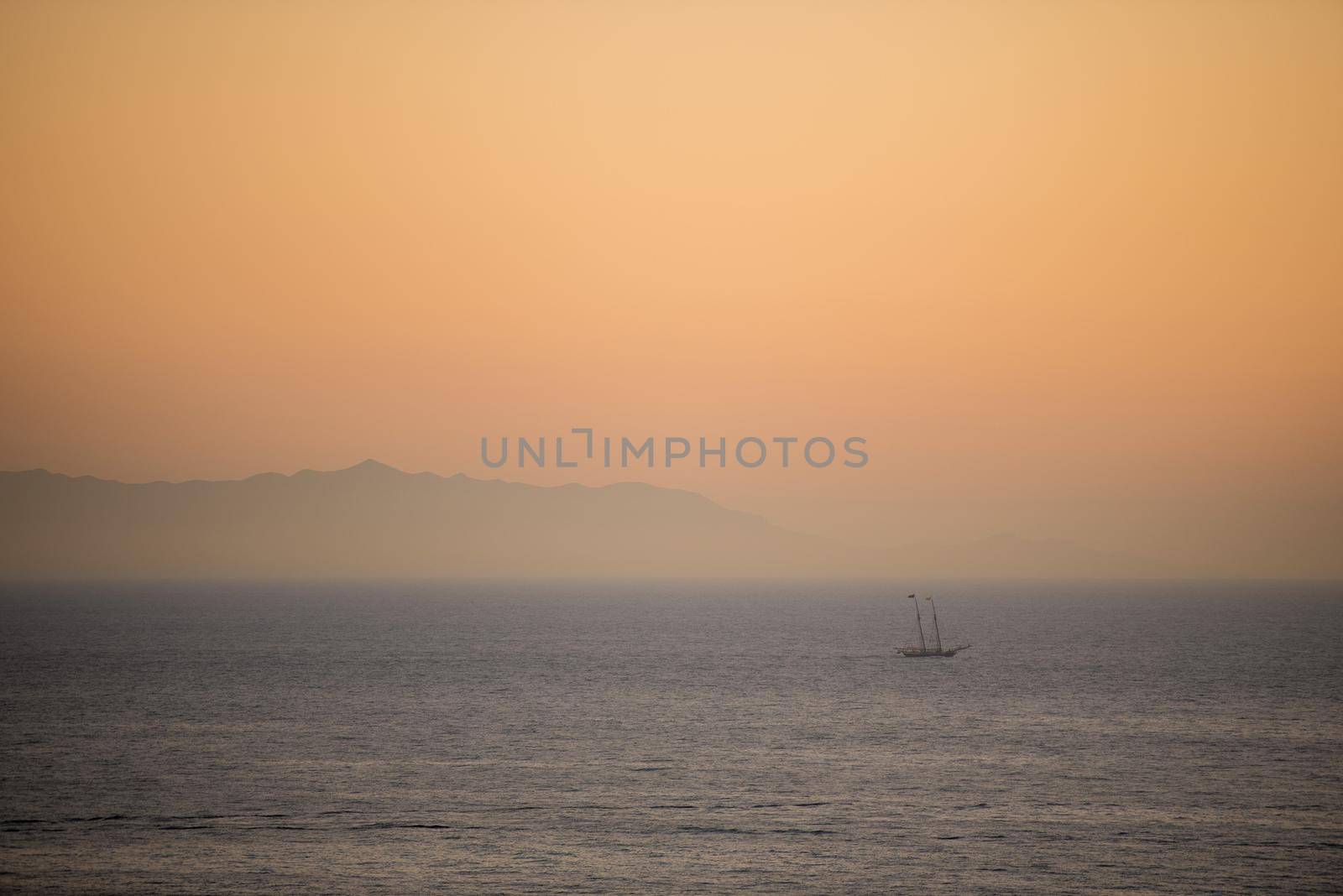 Catalina Island dramatic seascape with ship and mountains in the distance by jyurinko