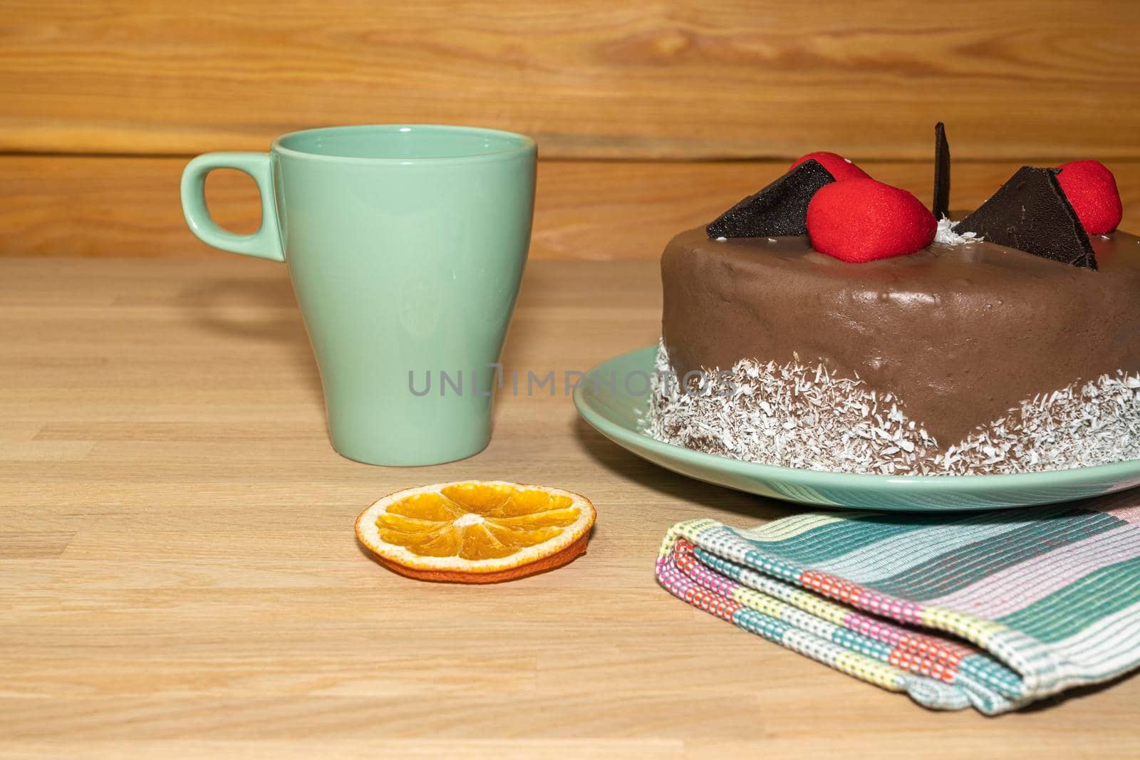 chocolate cake on the table on a light background by roman112007