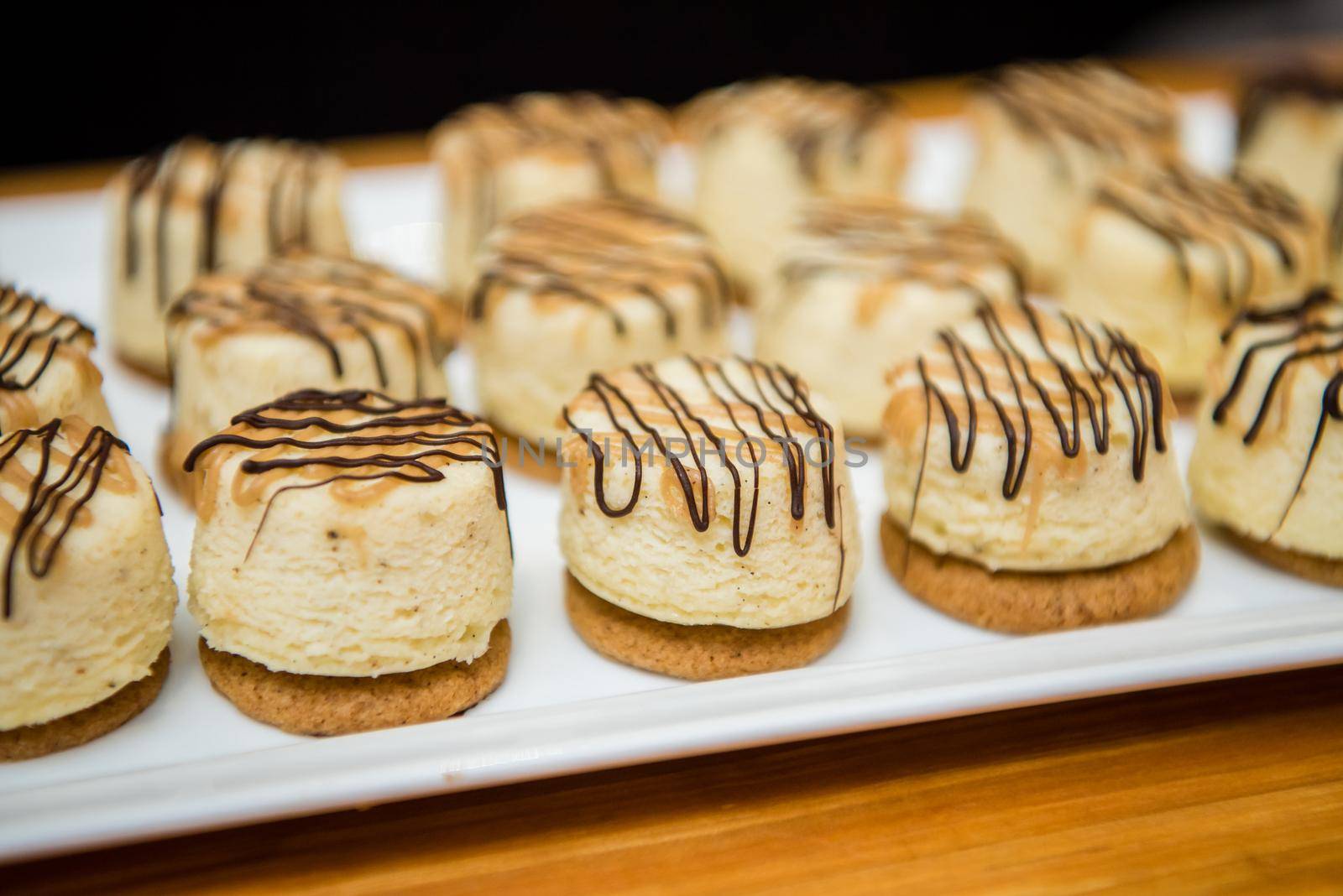 Gourmet dessert pastries with vanilla filling and chocolate icing. by jyurinko