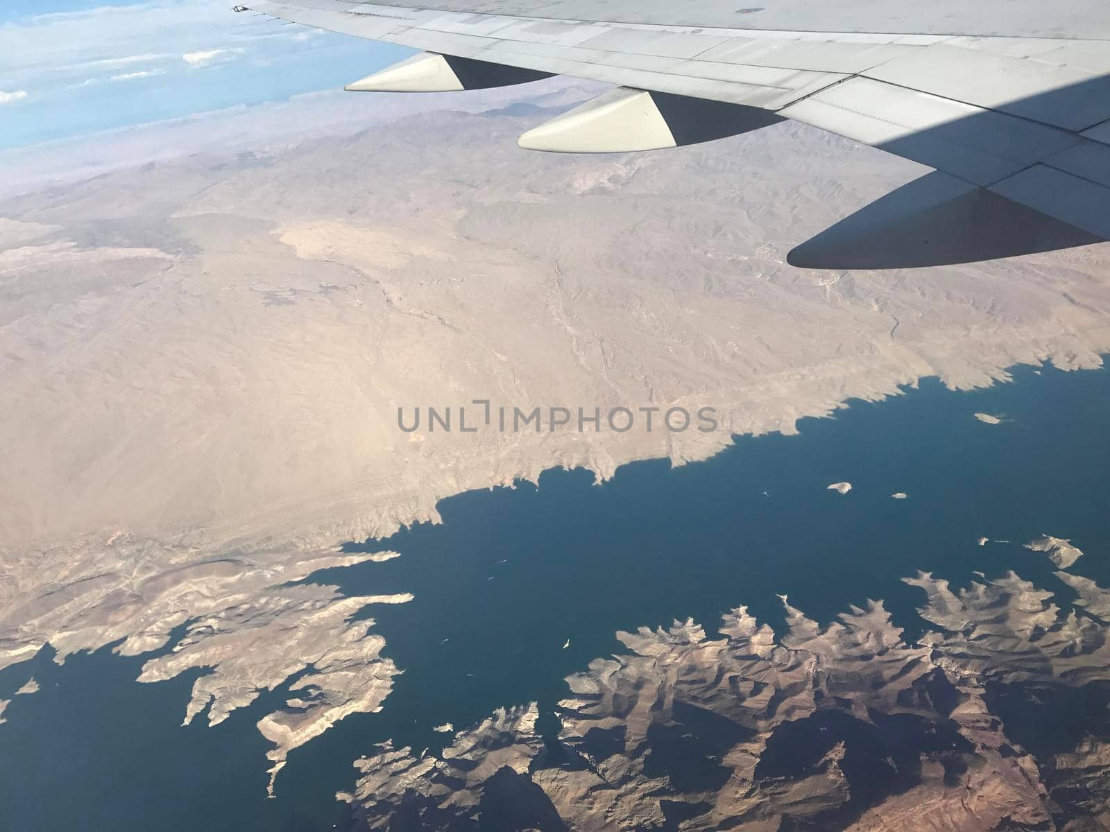 Window view from airplane over Lake Tahoe by jyurinko