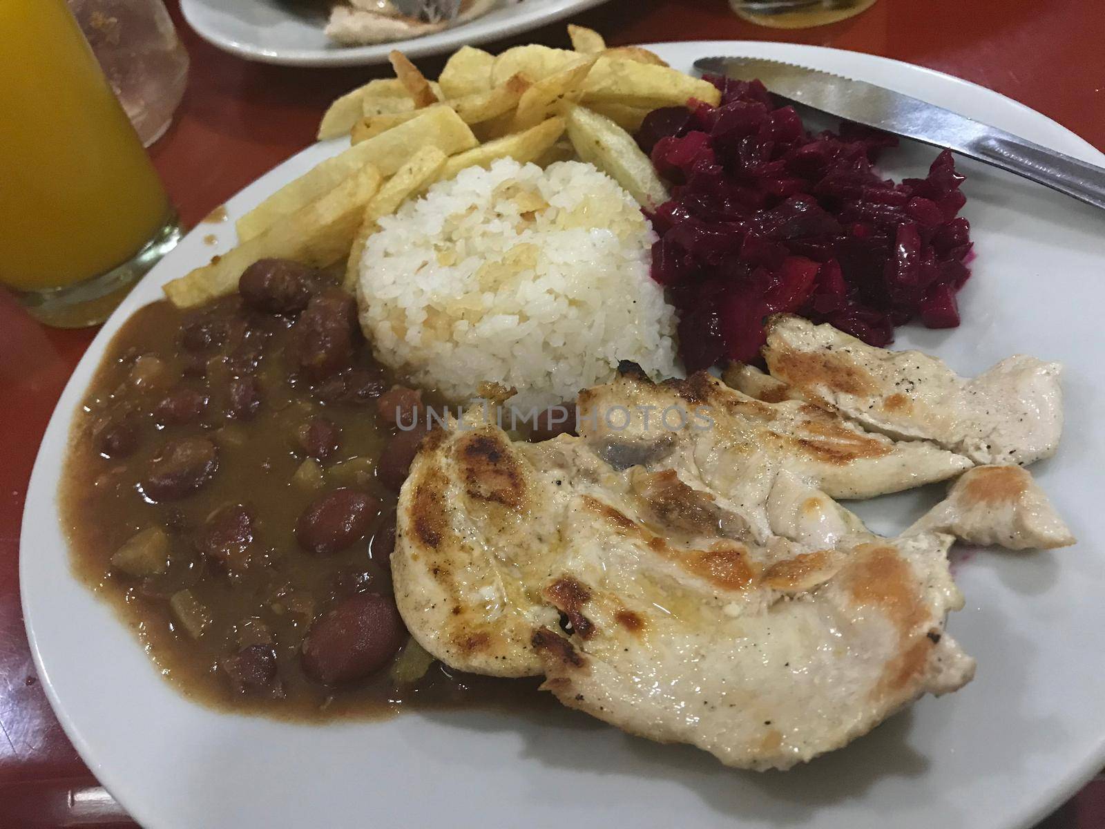 Traditional Colombian dish. with chicken, beans, rice, beets by jyurinko