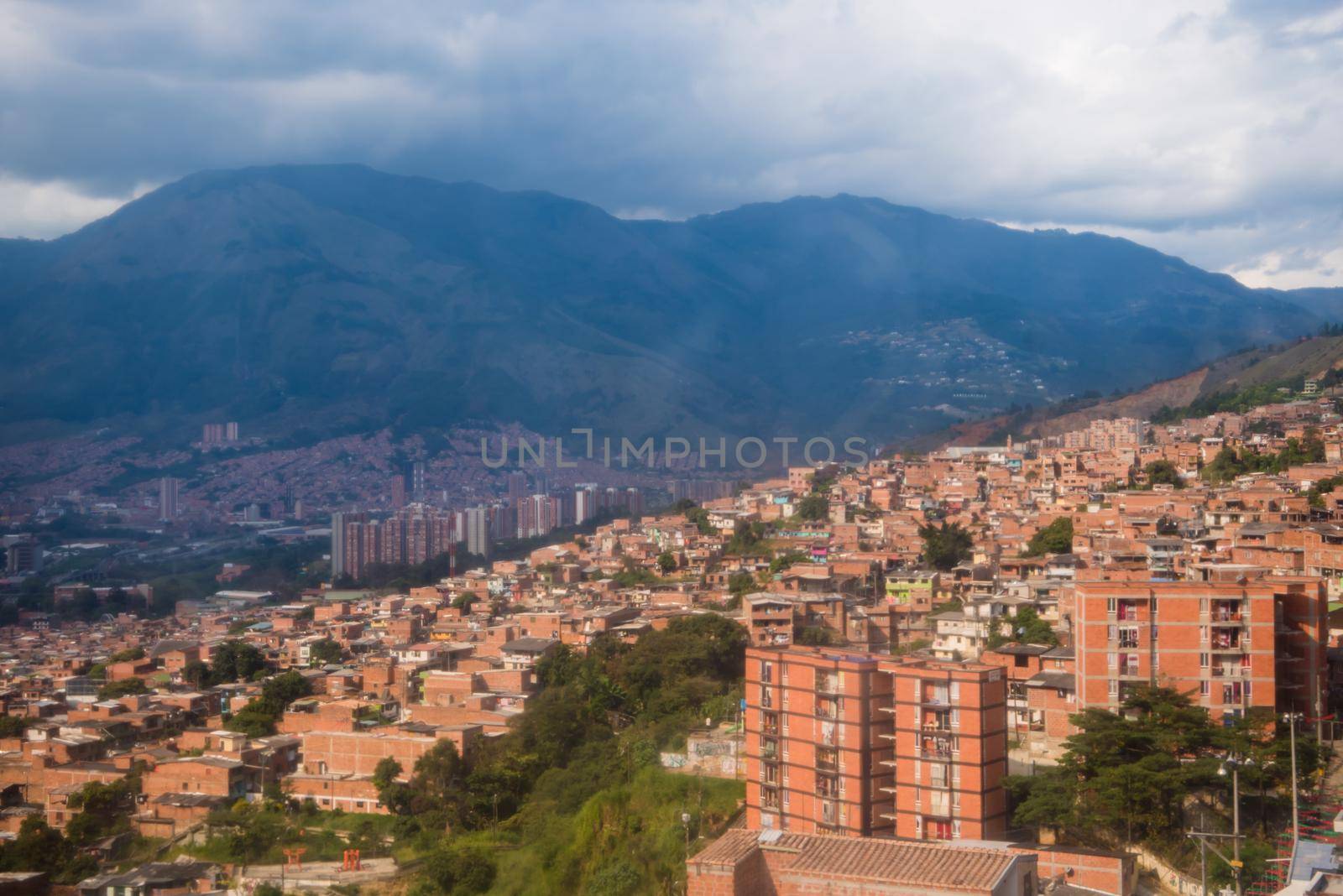 Cable car route in Medellin, Colombia many red homes by jyurinko