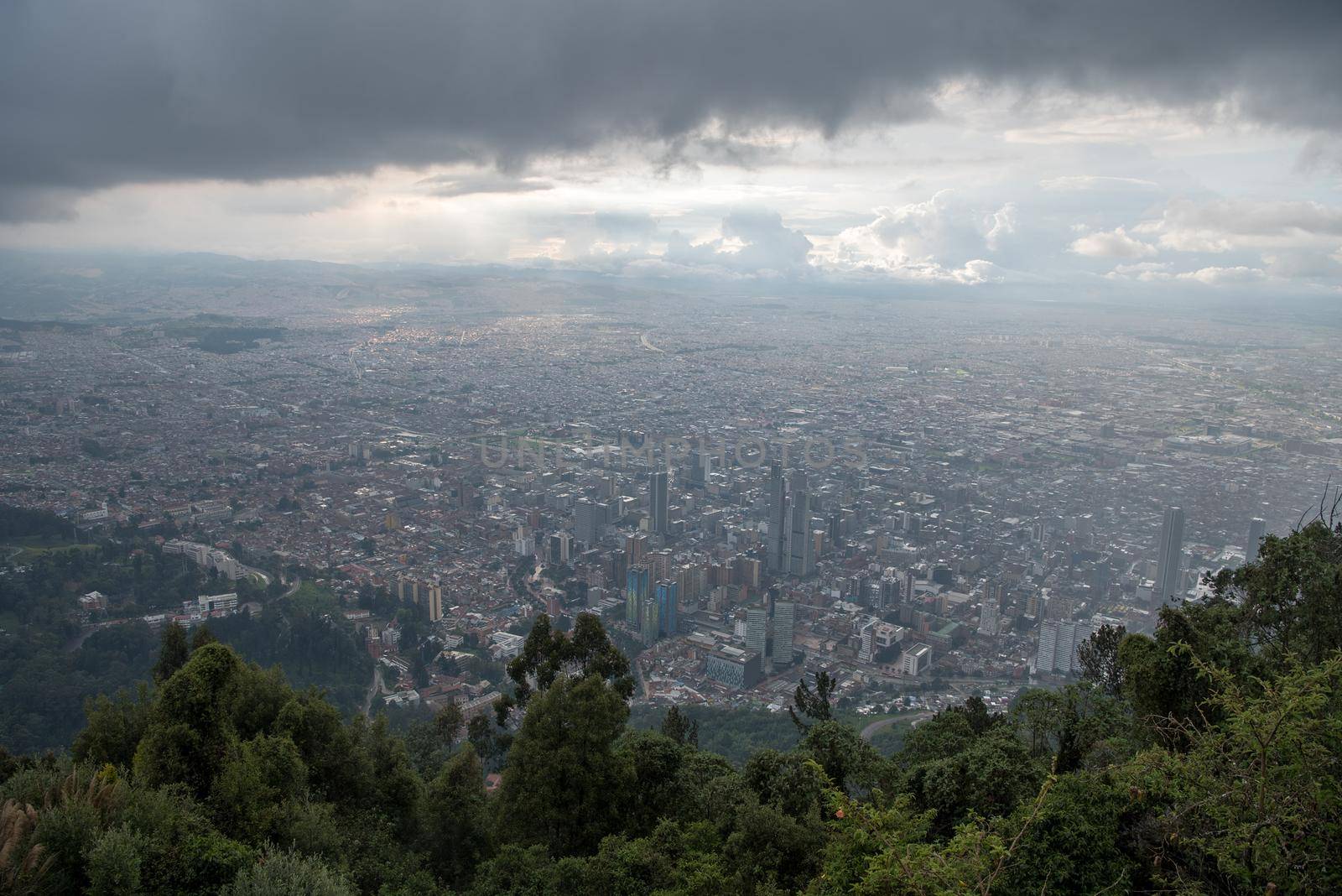 Mount Monserrate in Bogota, Colombia. Storm clouds and skyline. by jyurinko