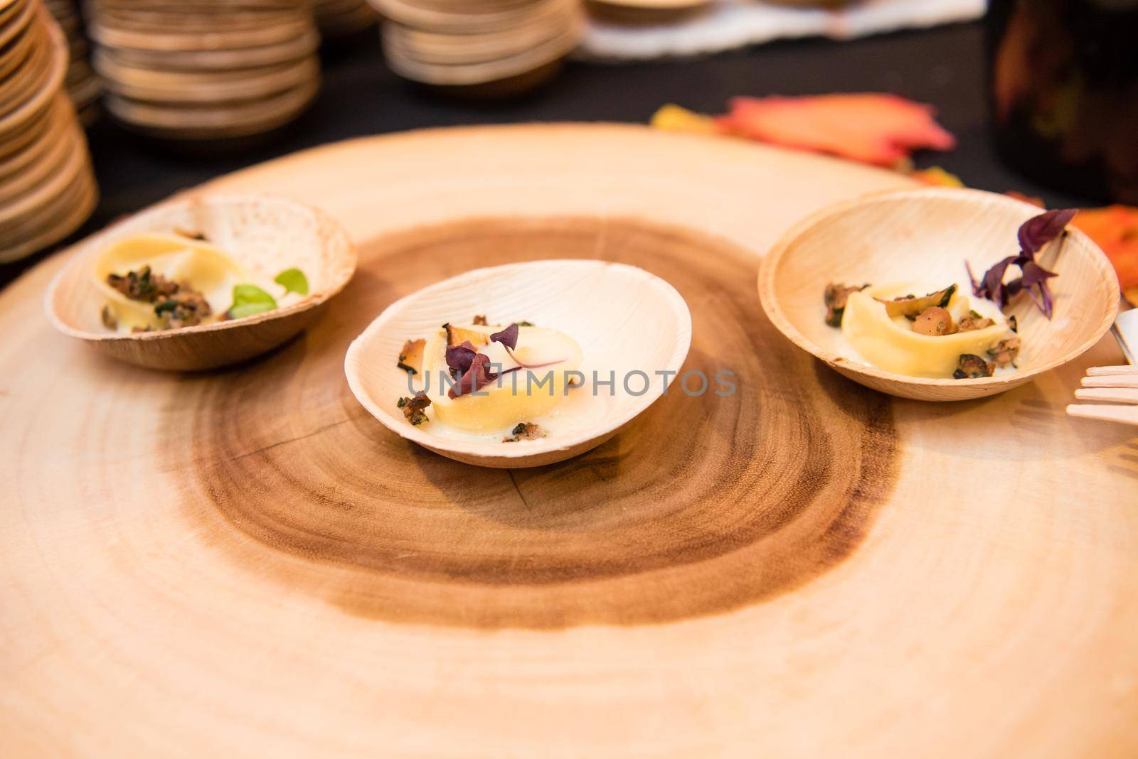 Decorative dessert plates on large piece of wood. by jyurinko
