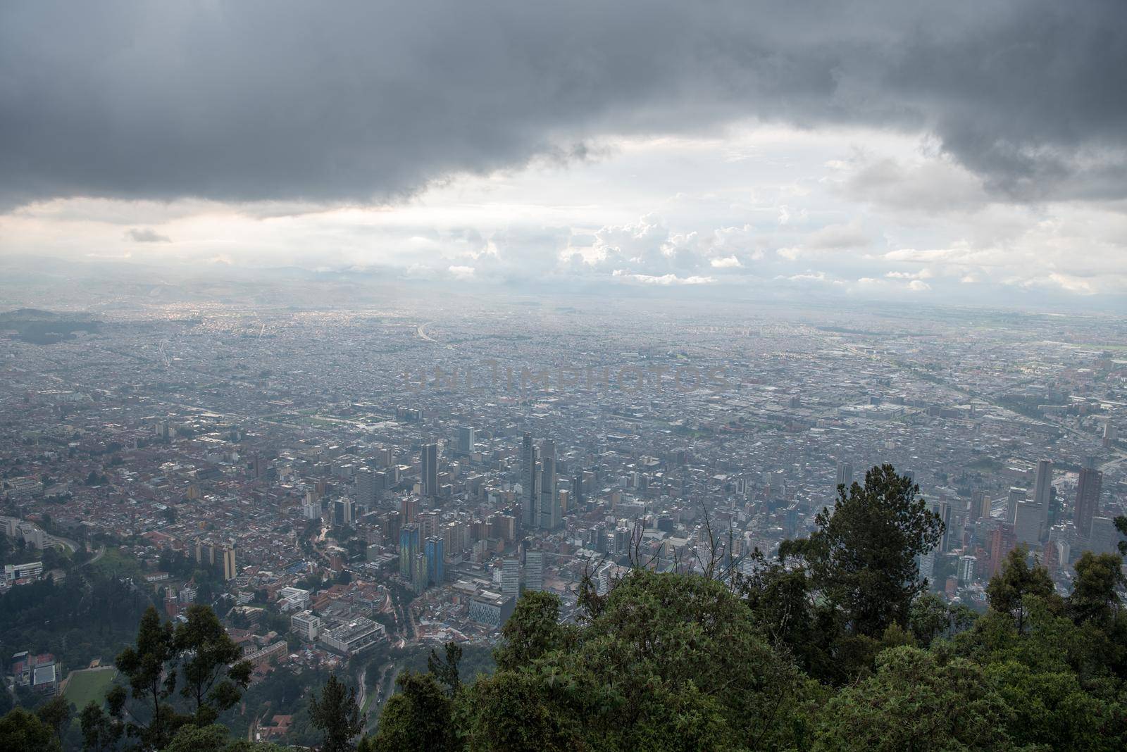Mount Monserrate in Bogota, Colombia. Storm clouds and skyline. by jyurinko