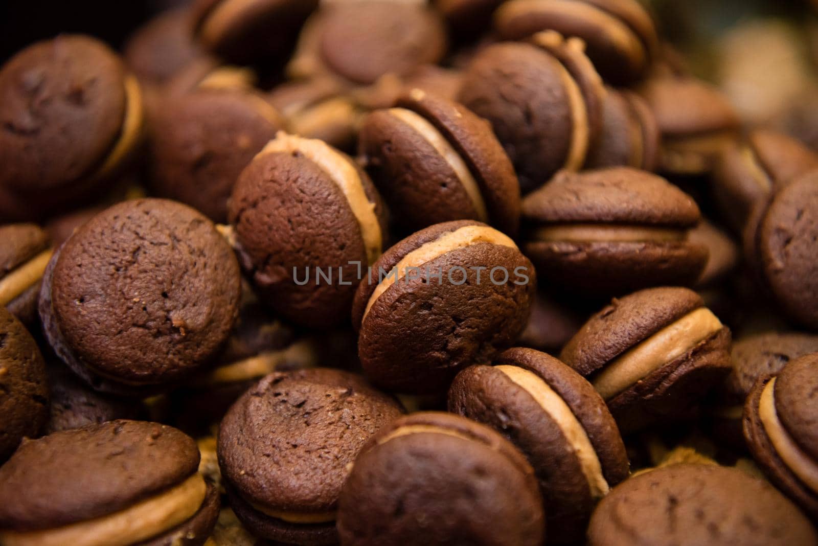 Chocolate sandwich cookie with cream filling. Dessert close up