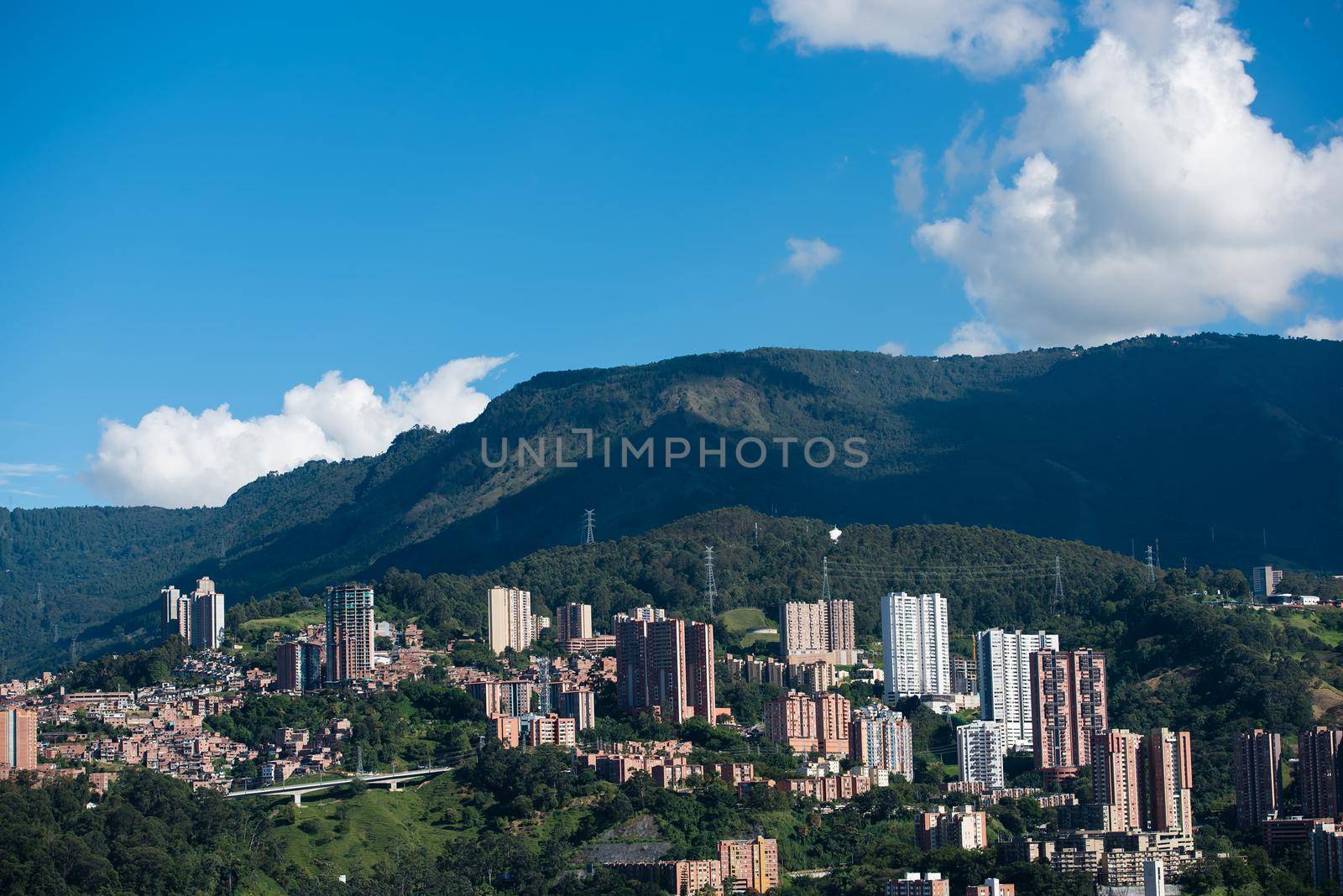 Rolling hills and village of Bogota Colombia blue sky.