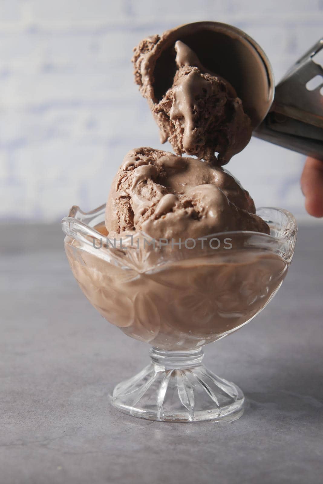 chocolate flavor ice cream in a container .