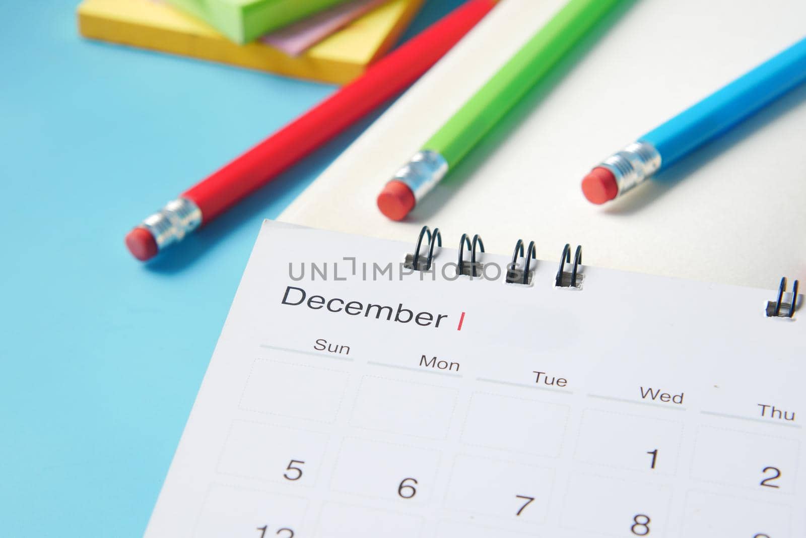 december month on calendar on office desk.
