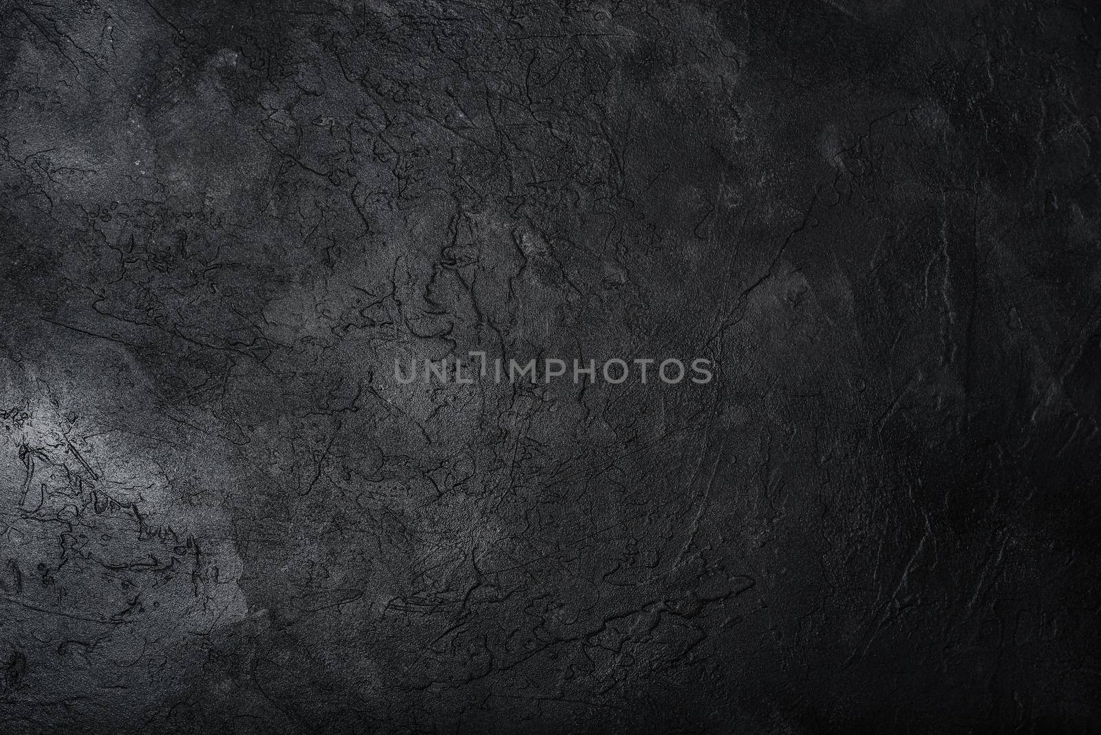 Dark textured concrete wall background. Copy space