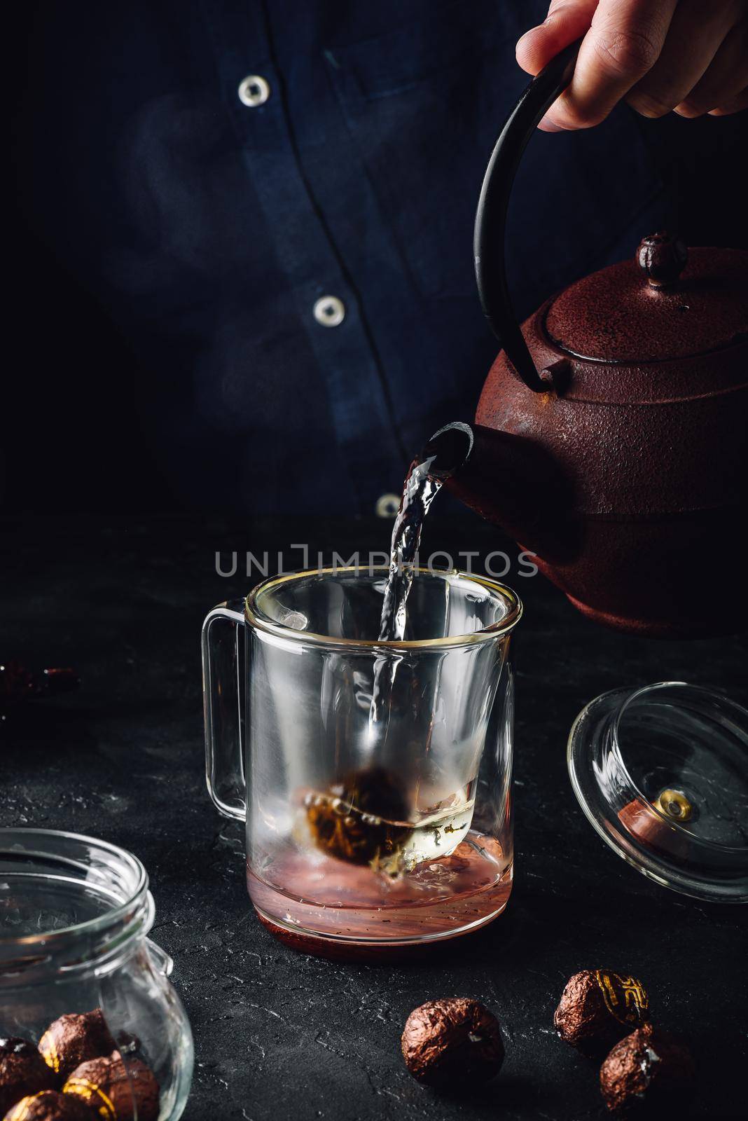 Steeping red tea in glass mug by Seva_blsv