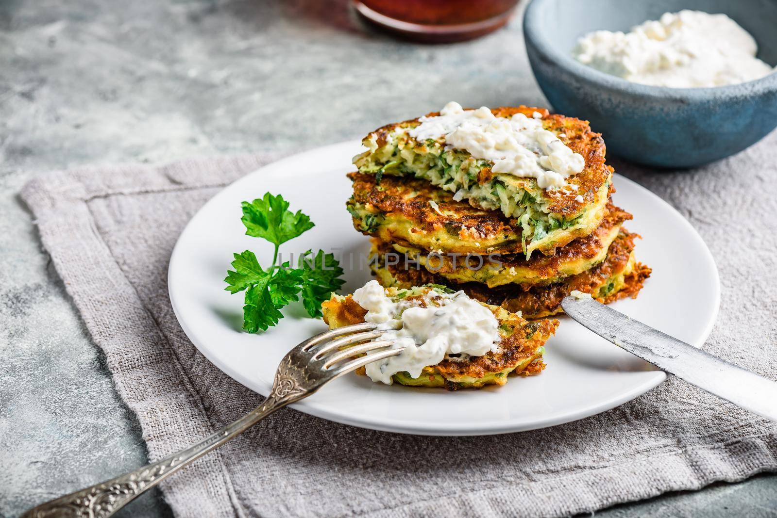 Zucchini parmesan pancakes with dip by Seva_blsv