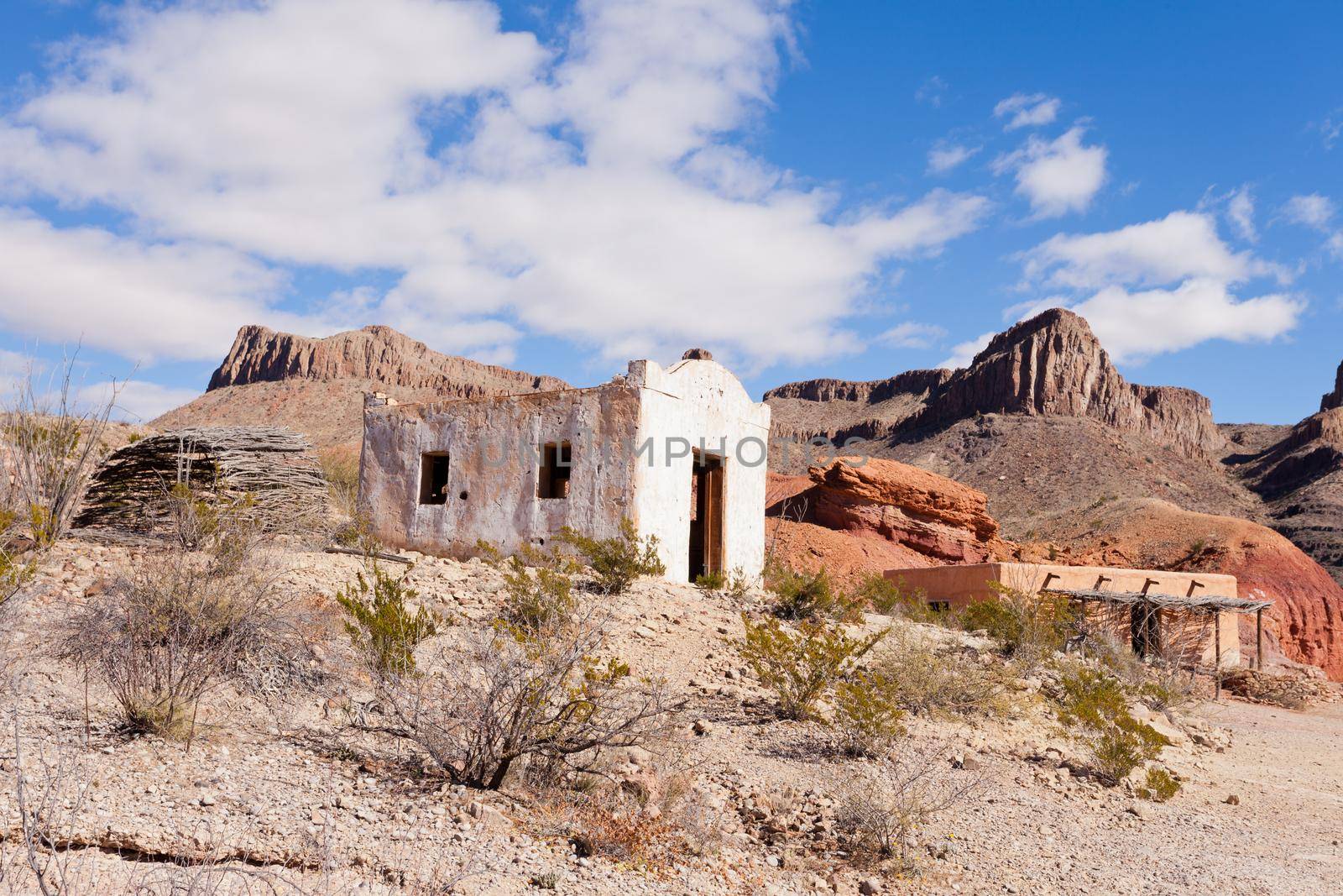 Deserted rancheria adobe buildings in colorful hot rocky desert of south western Texas, USA