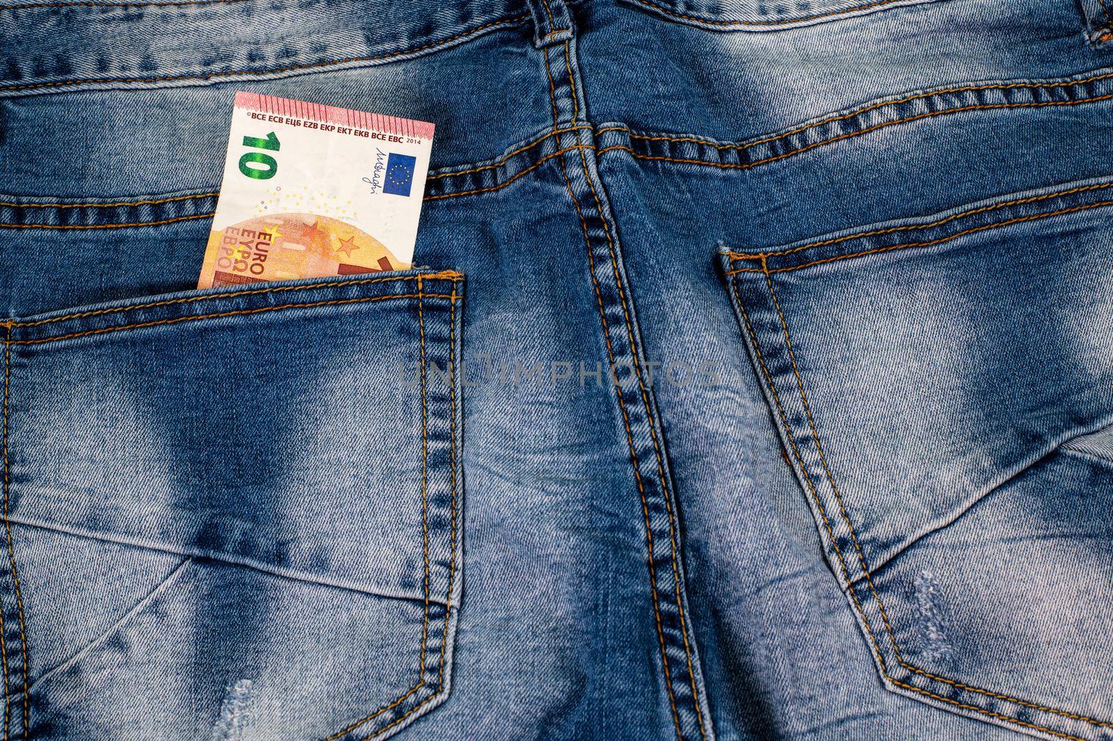 10 euros coming out of the jeans pocket by carfedeph