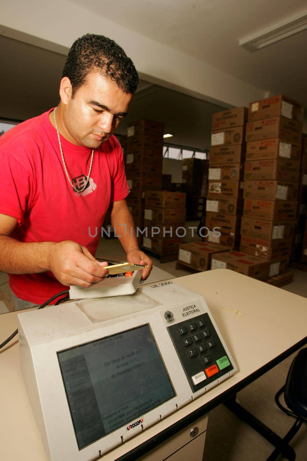 salvador, bahia, brazil - october 1, 2010: Technician reviews an electronic ballot box of electoral justice before elections in the city of Salvador.