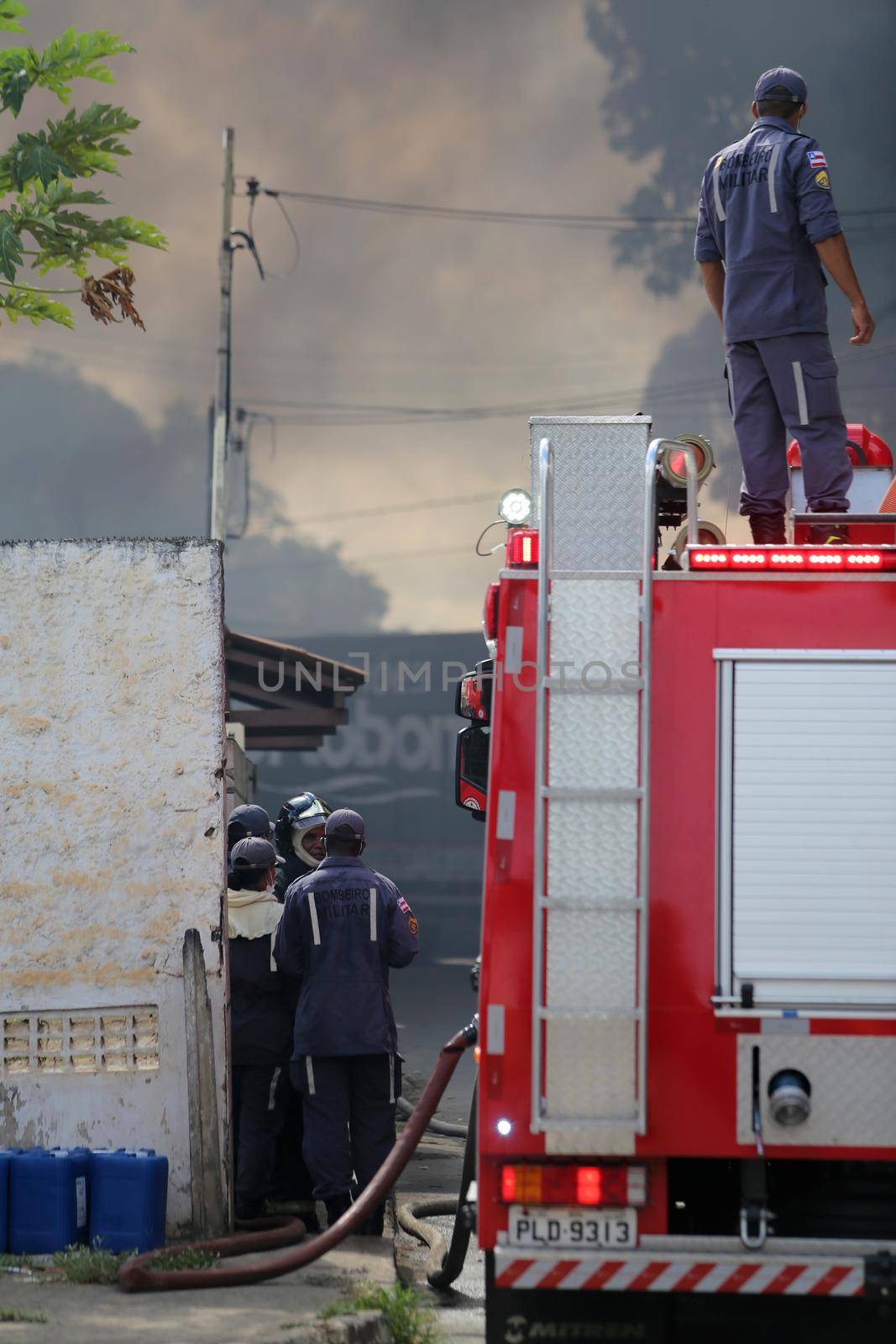 salvador, bahia, brazil - march 19, 2019: Members of the Fire Department fire fighting the mattress factory in the Valeria neighborhood in the city of Salvador.