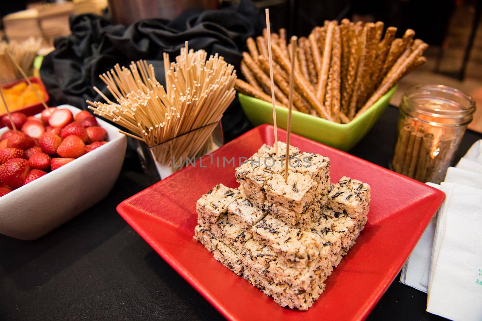 Festive rice crispy treat display with pretzel sticks. by jyurinko