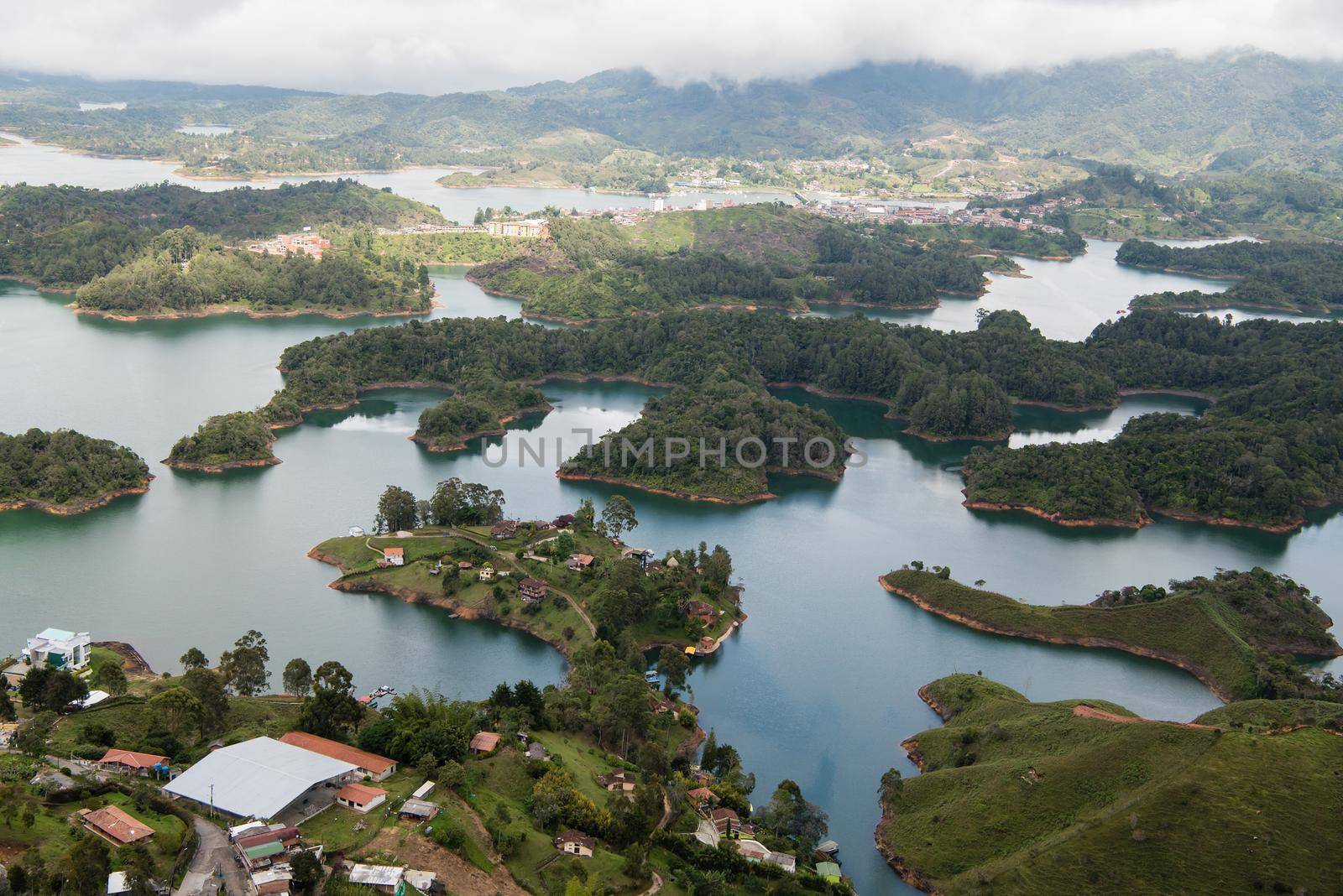 Climbing El Penon de Guatape looking down at tropical waters by jyurinko