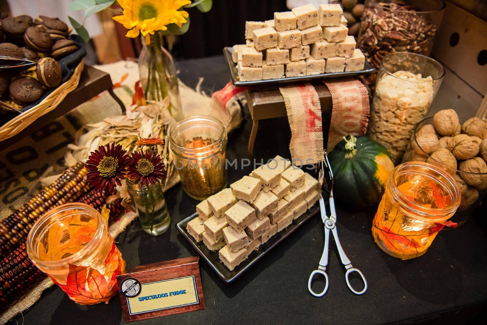 Fall festive food spread with fudge flowers and colorful leaf decor. Top view by jyurinko