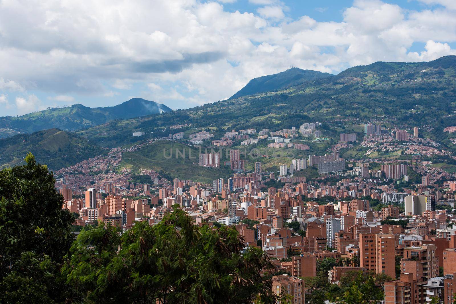 Rolling hills of village and clouds of Bogota Colombia. by jyurinko