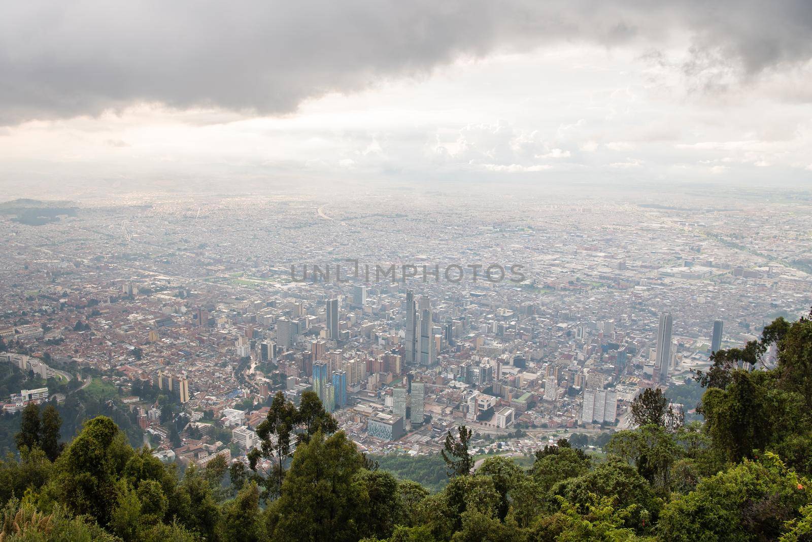 Mount Monserrate in Bogota, Colombia. Storm clouds and skyline. by jyurinko