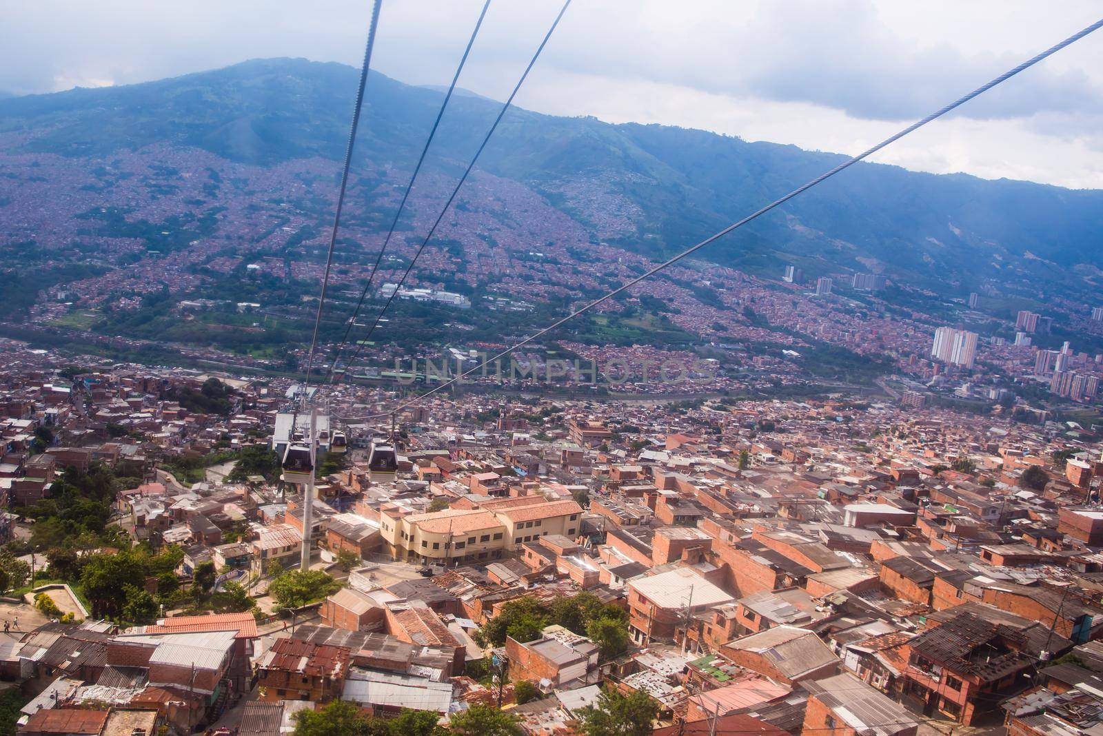 Cable car route over many red roof homes by jyurinko