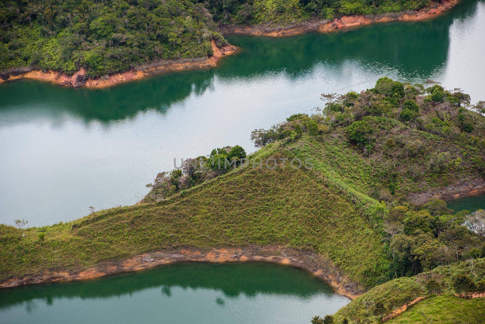 El Penon de Guatape looking out at a beautiful view of the lagoon. Close up by jyurinko