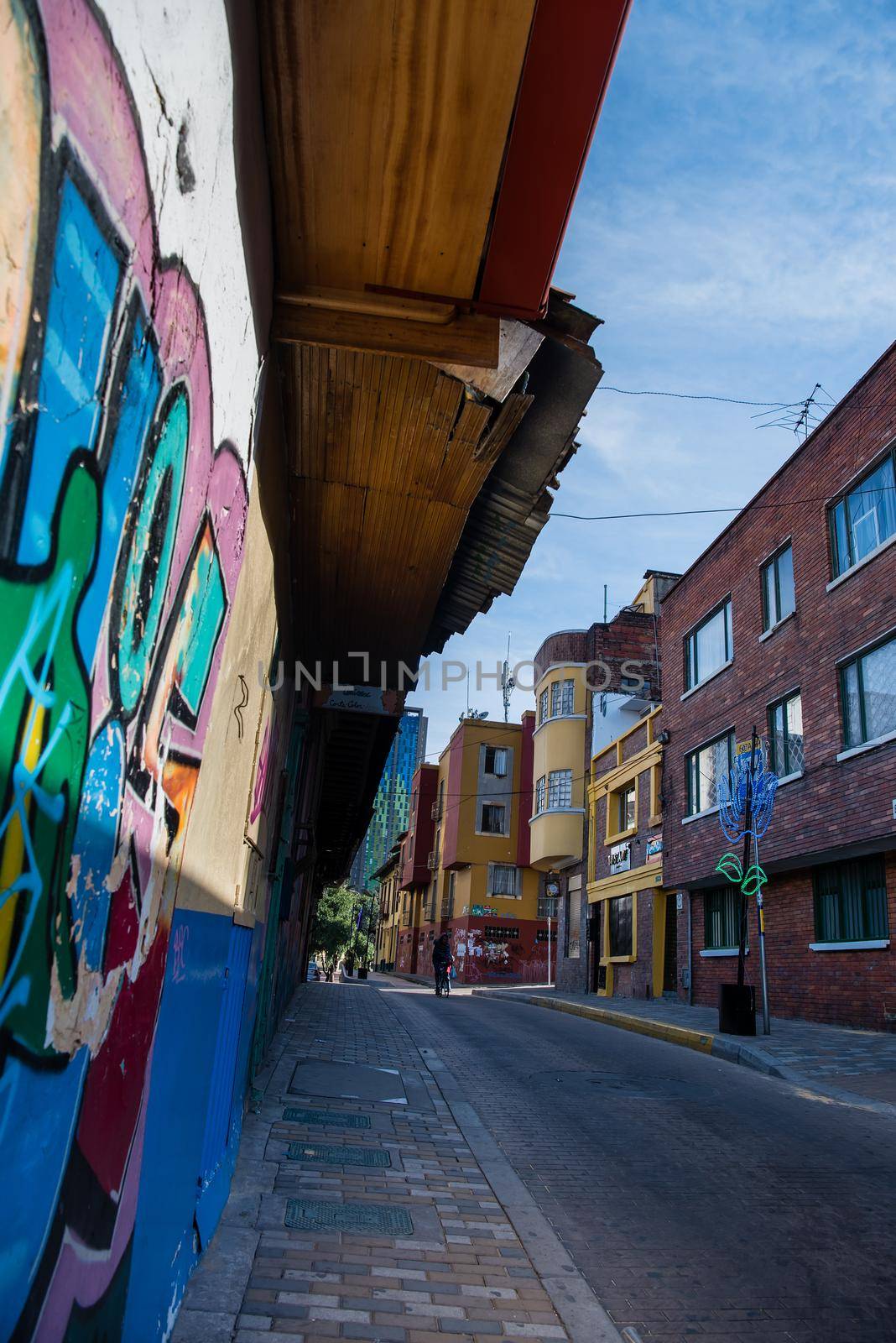Graffiti walls of colorful art in Bogota, Colombia. Perspective view by jyurinko