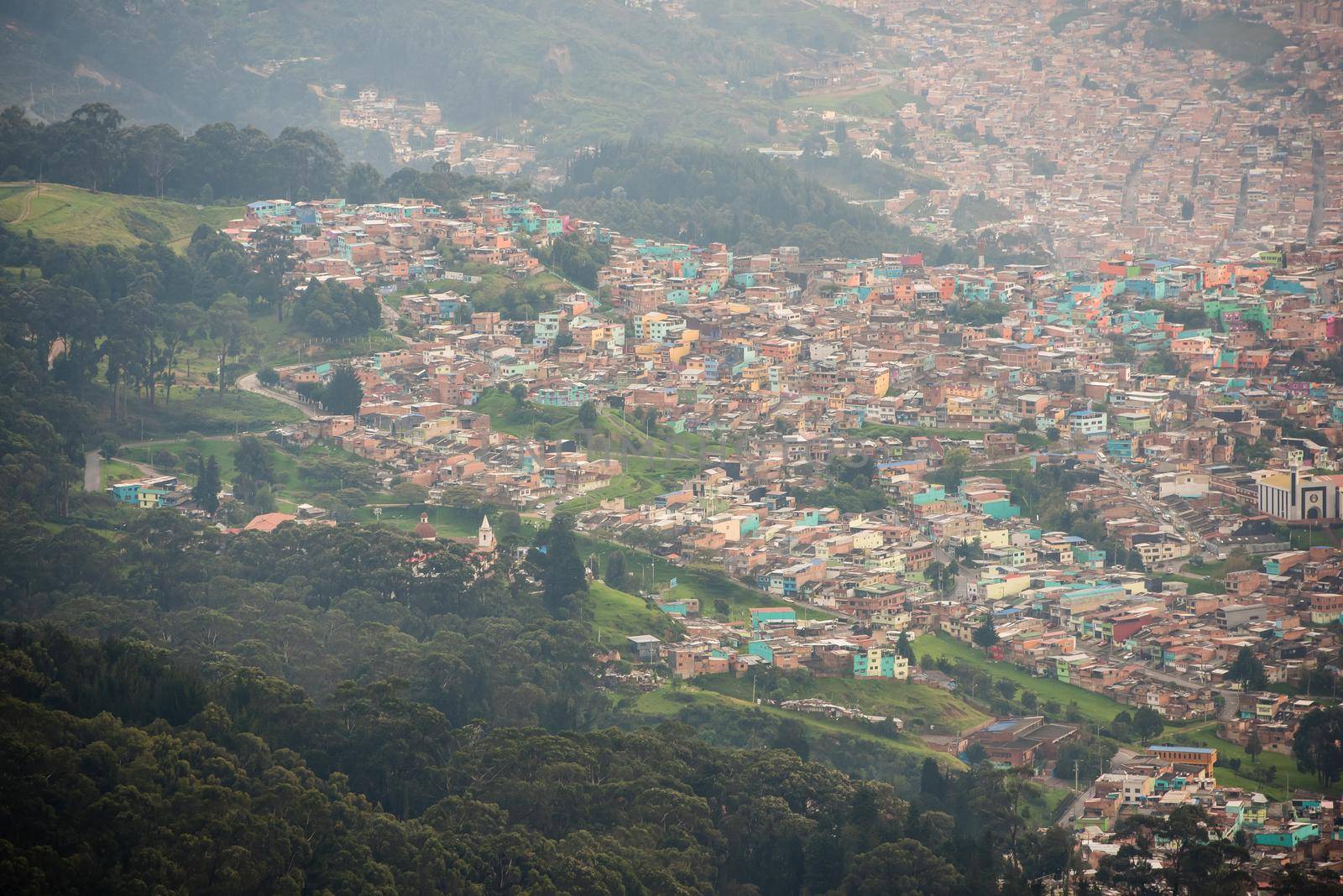 Pastel homes from the top of Mount Montserrate in Bogota Colombia. by jyurinko