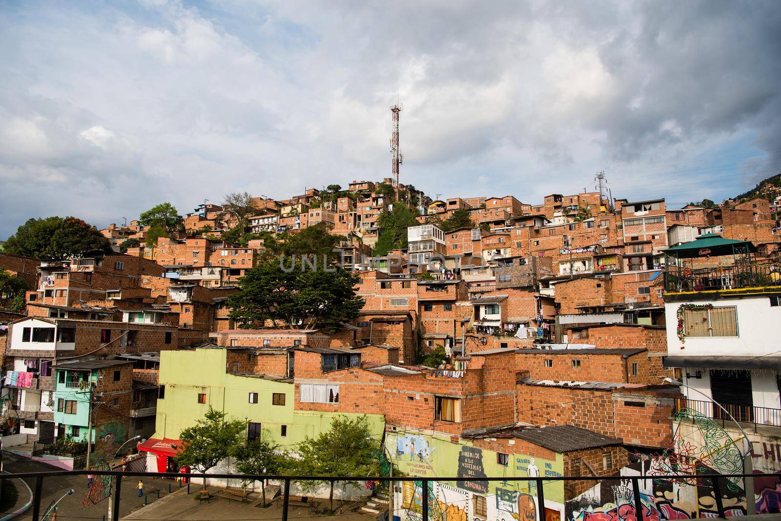 Homes in Medellin, Colombia with view of homes on hillside. by jyurinko